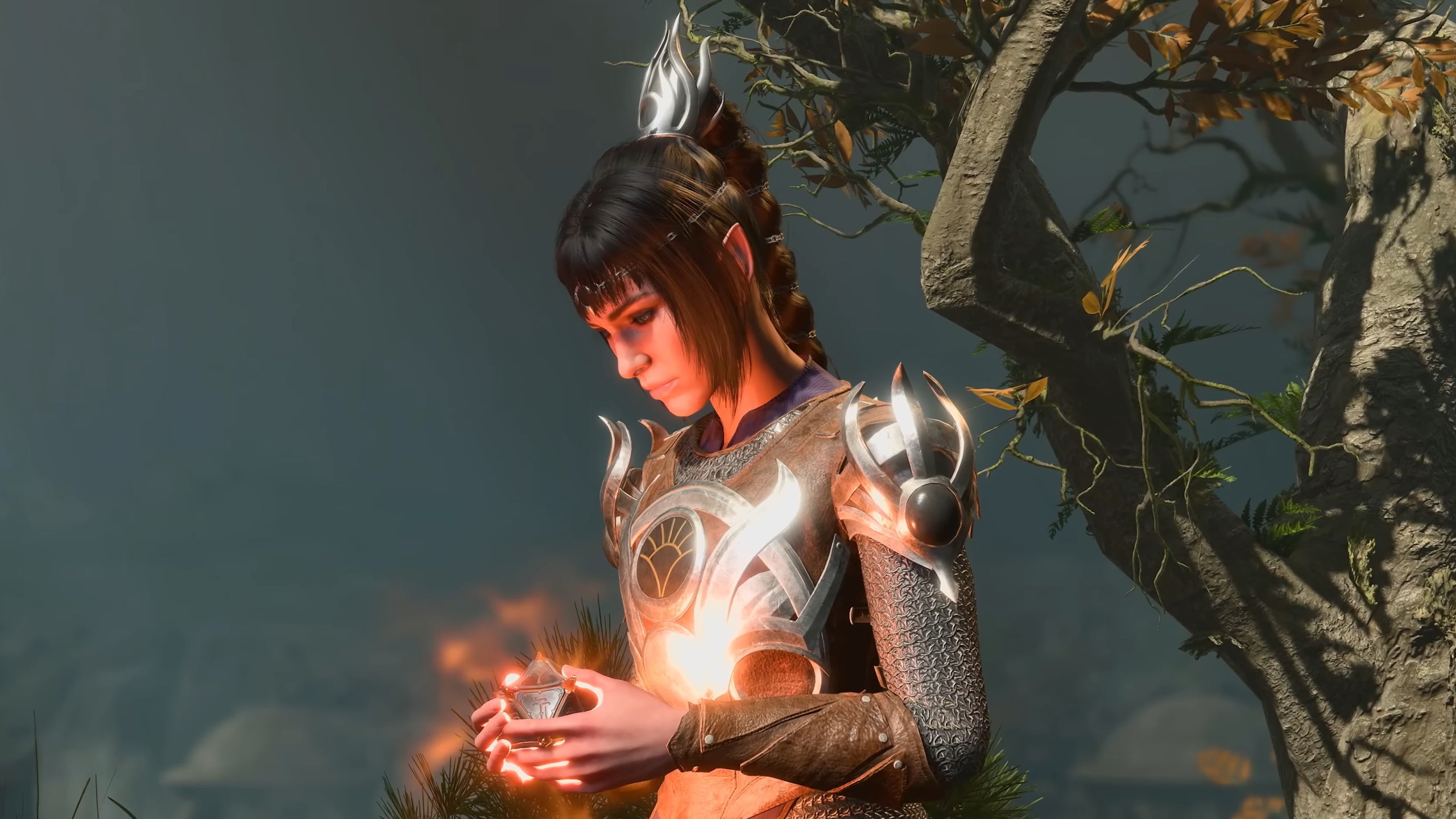 Shadowheart cradles a glowing orb in her hands in Baldur's Gate 3