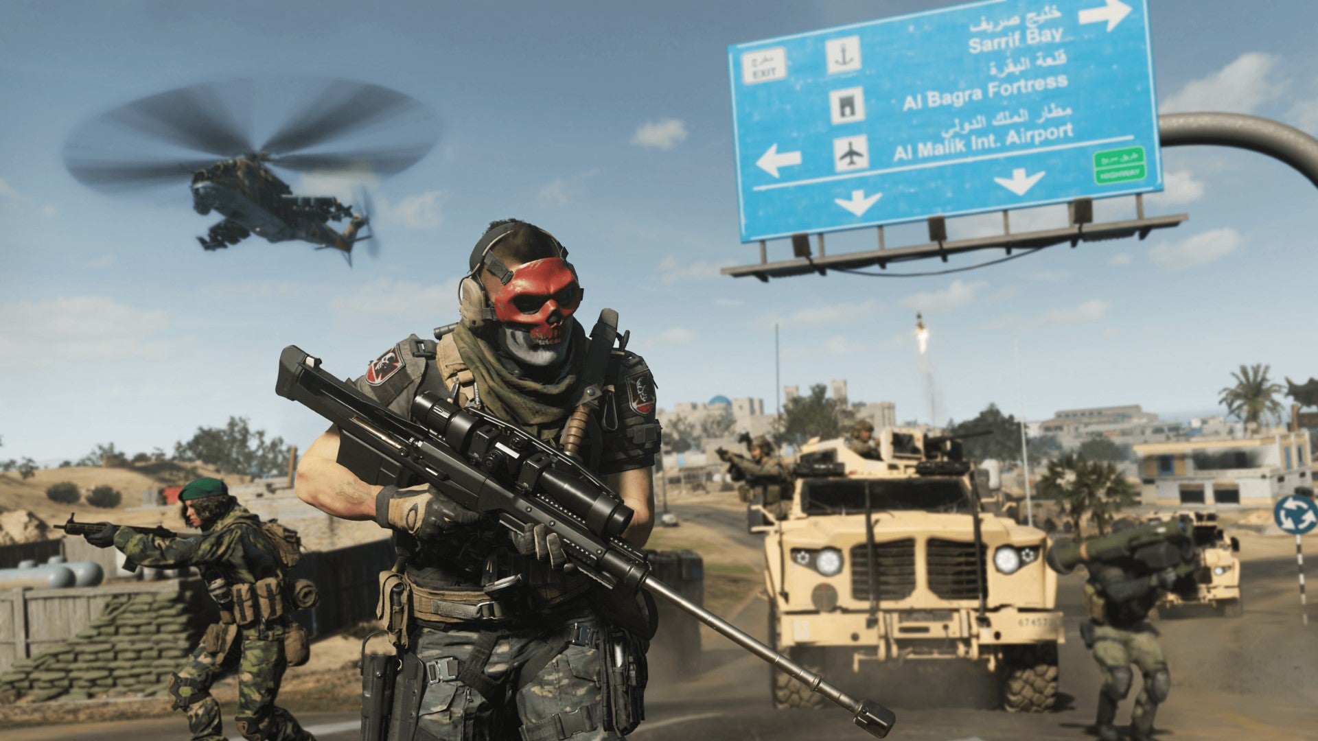 A soldier wearing a red mask holds a massive sniper rifle as a helicopter flies overhead in Call Of Duty: Modern Warfare 2.