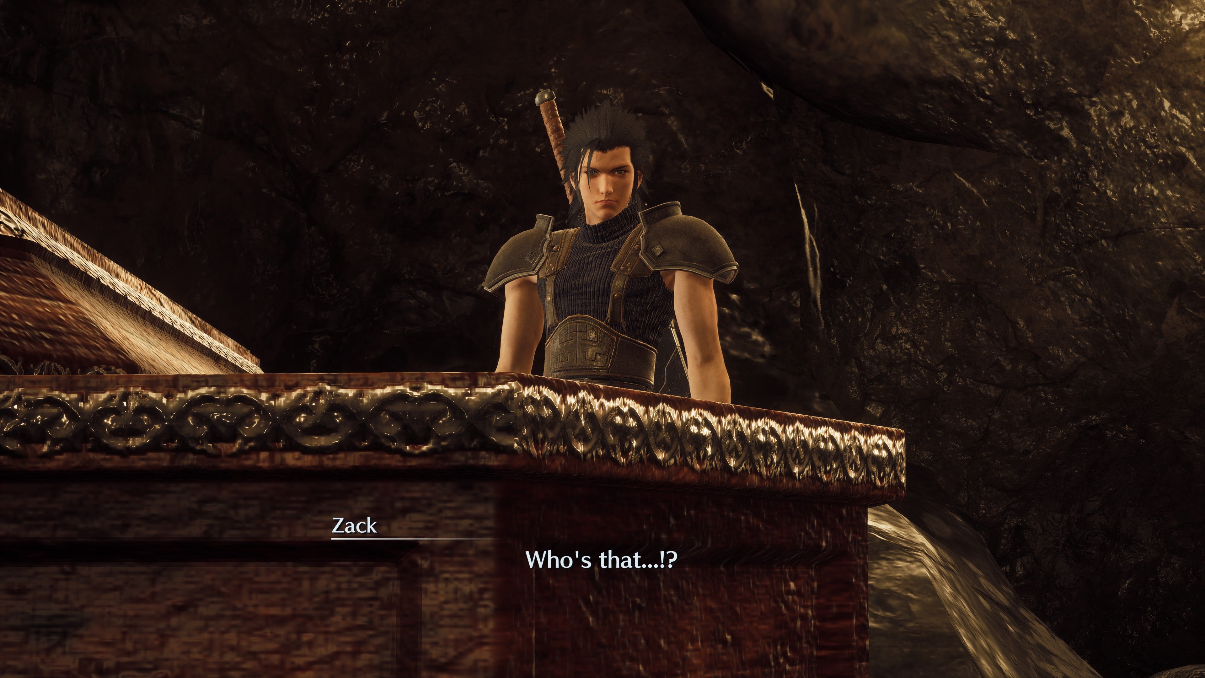 Zack looks down into a coffin in Crisis Core - Final Fantasy VII - Reunion with a surprised expression on his face.
