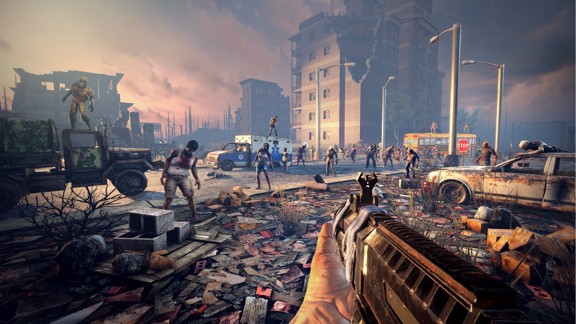 7 Days to Die image showing a player aiming an assault rifle towards a horde of zombies amidst ruined buildings.