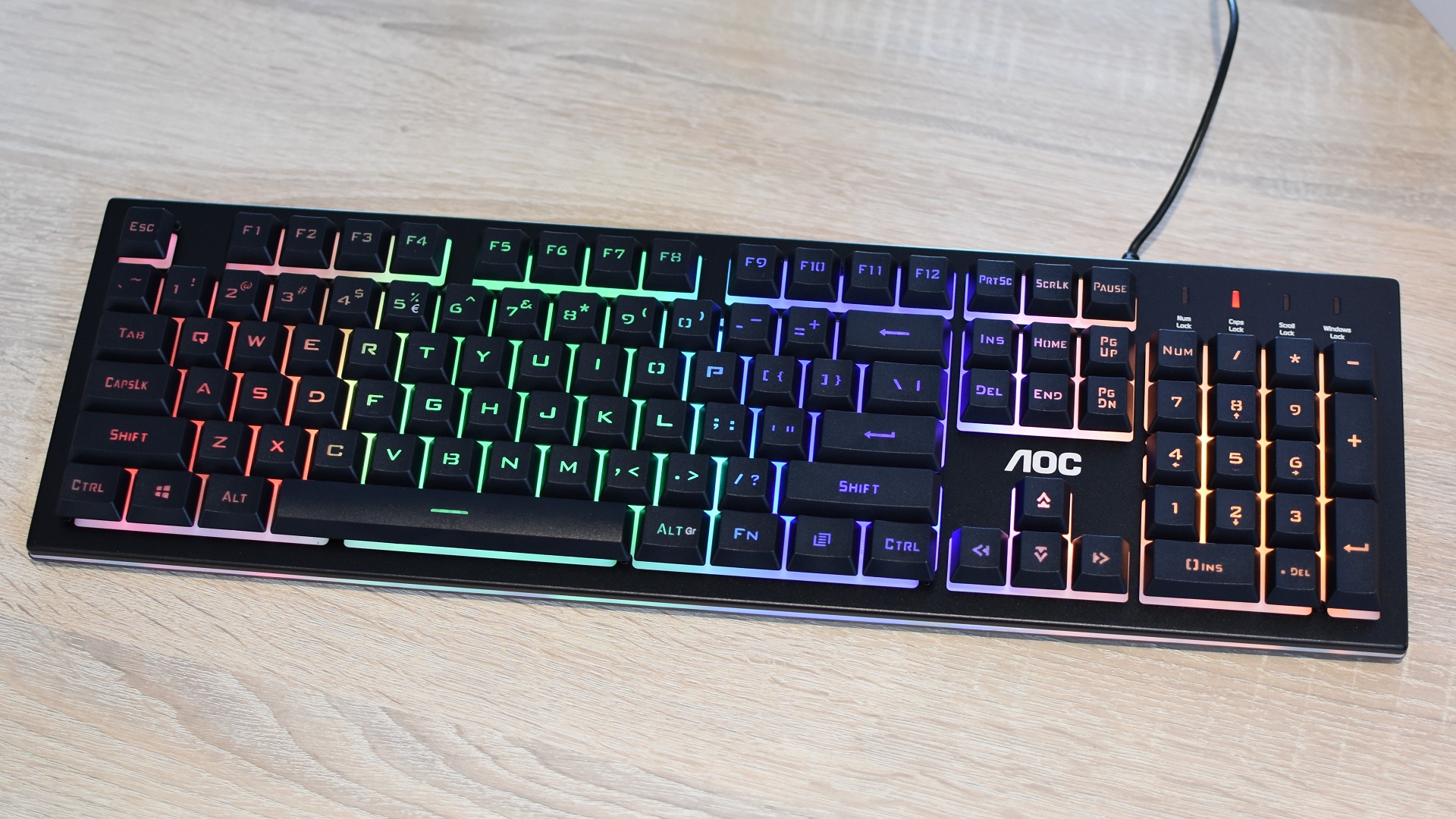 The AOC GK200 gaming keyboard on a desk.