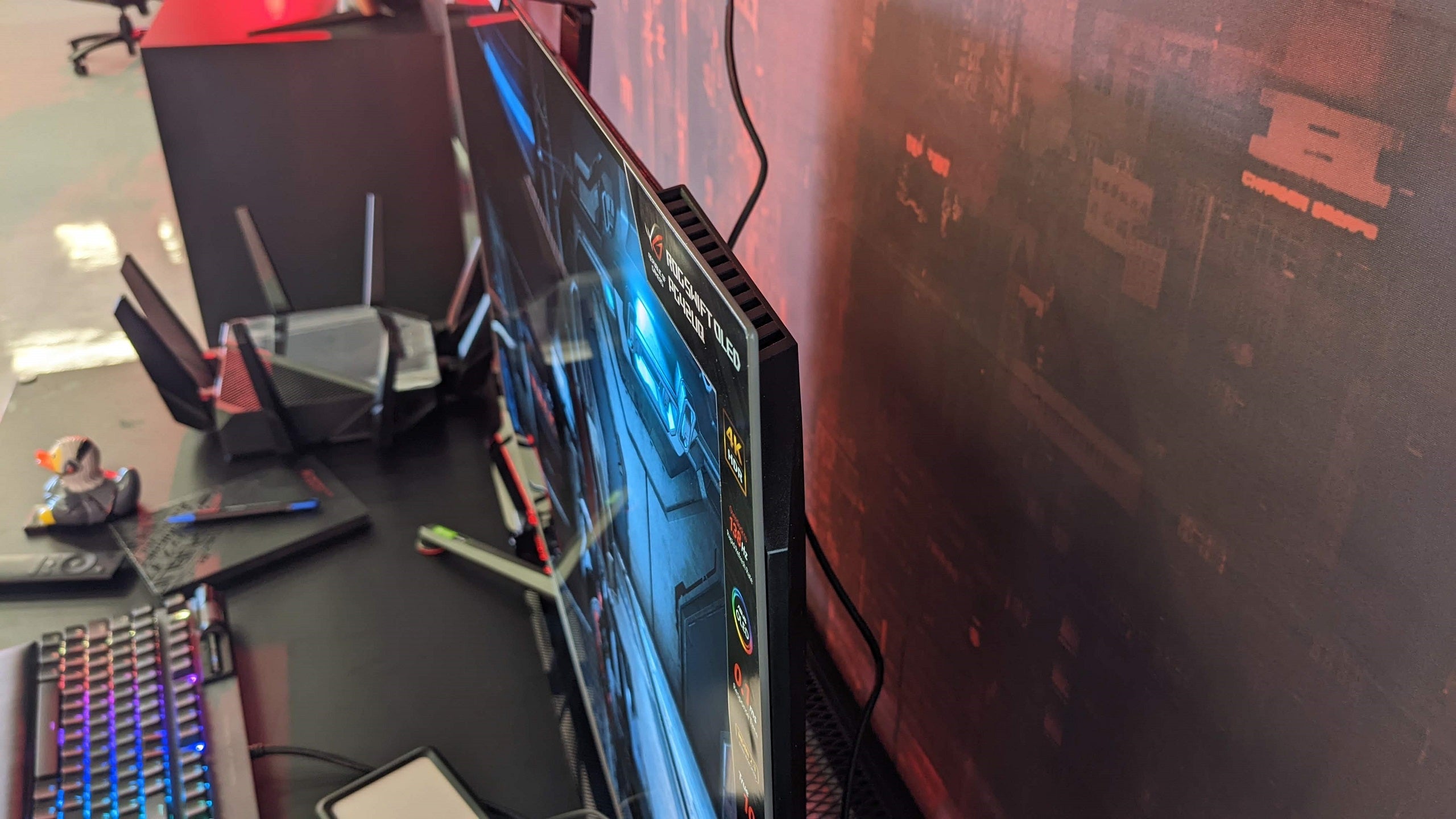 A close up on the ultra-thin bezel of an Asus ROG Swift PG42UQ gaming monitor.
