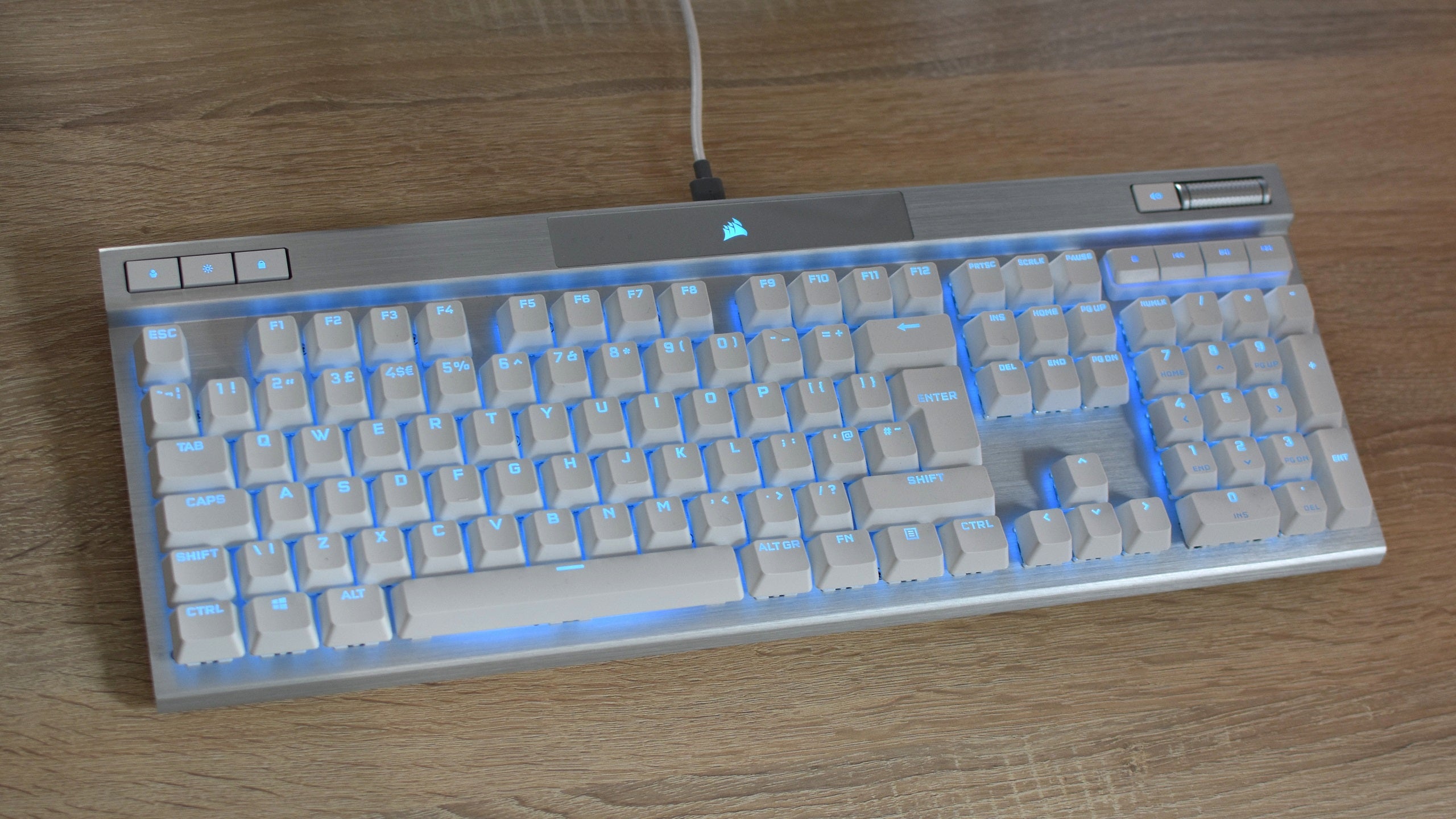 The Corsair K70 Pro optical-mechanical gaming keyboard on a desk.