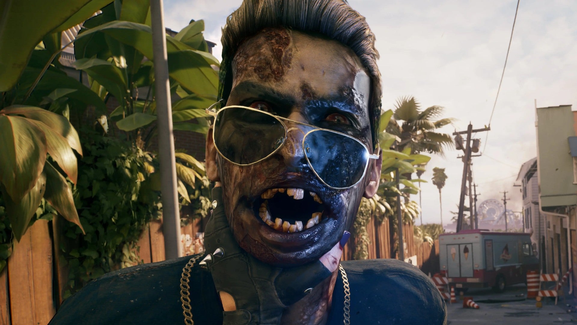 Dead Island 2 image showing a close up of a zombie wearing sunglasses. Their mouth is open, revealing a set of jagged, broken teeth.