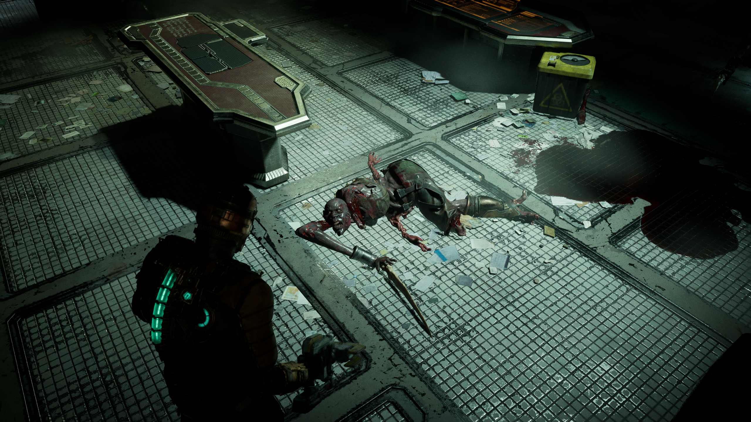 A dead Slasher necromorph lies on the ground in the Dead Space remake.