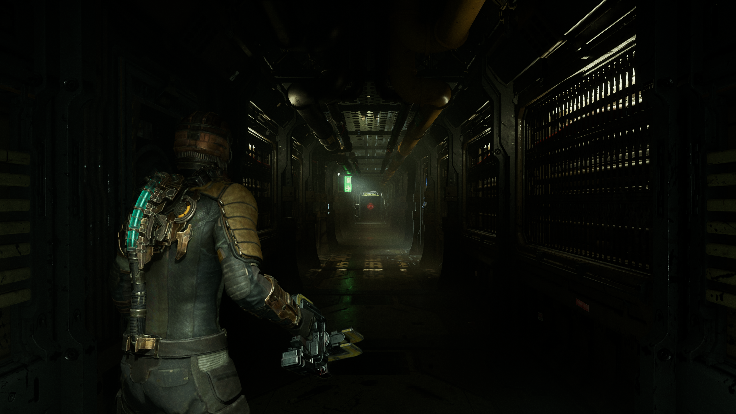 Isaac enters a forebodingly long, seeming empty hallway in the Dead Space remake.