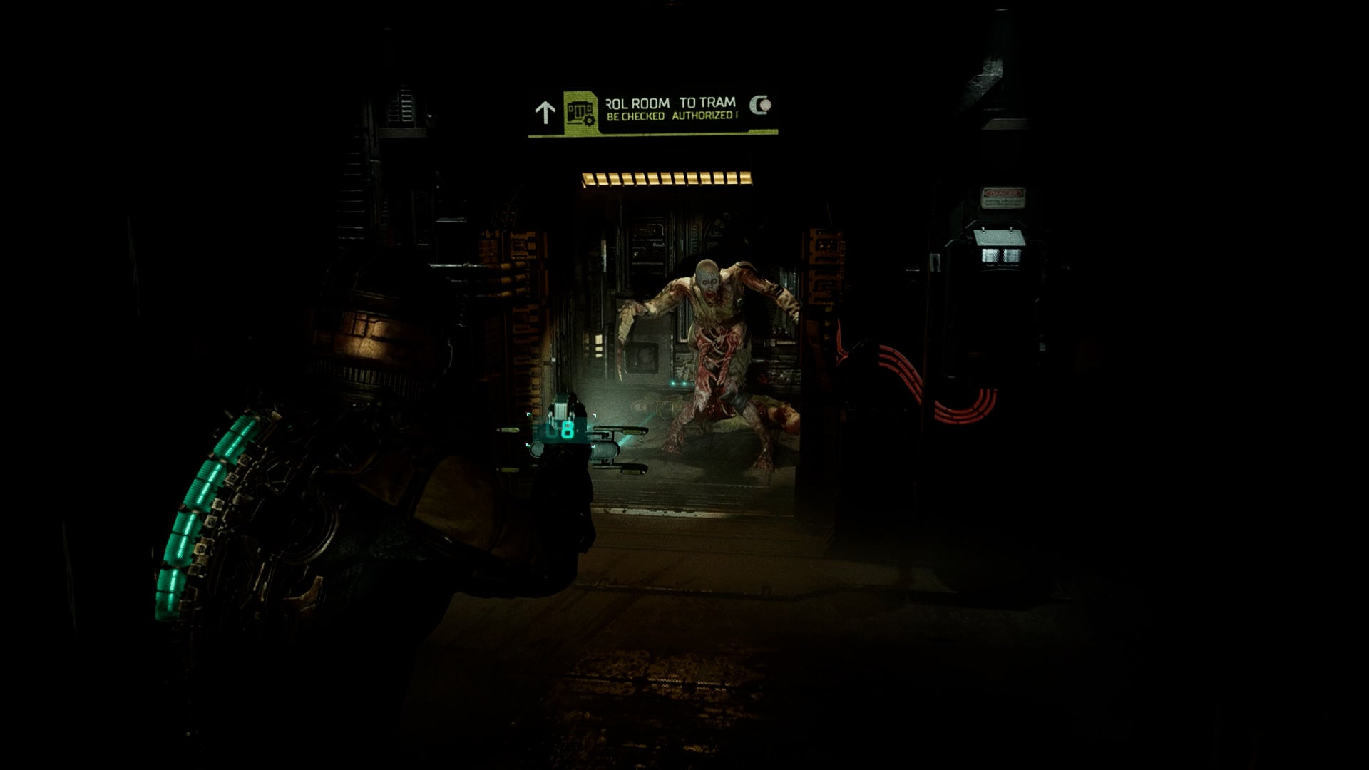 Isaac points his plasma cutter at a necromorph in Dead Space