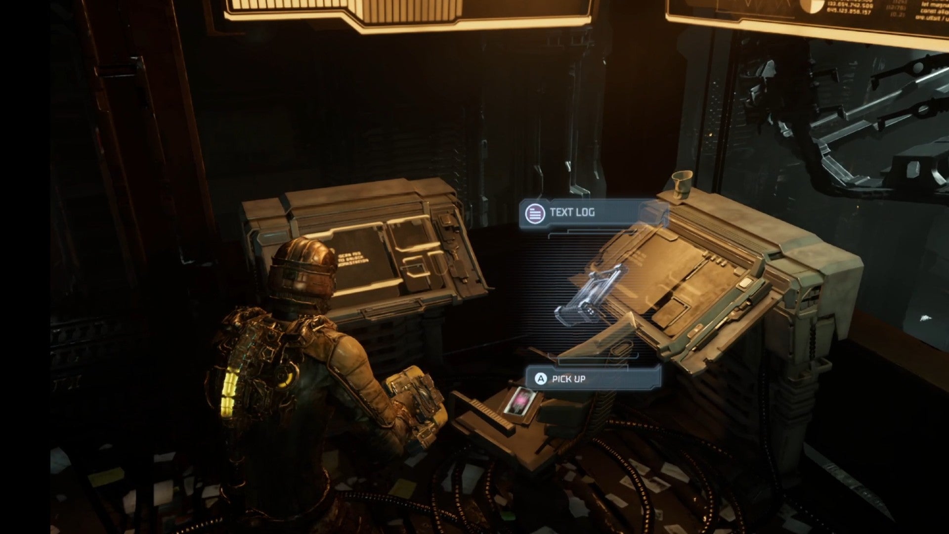 Dead Space image showing a Text Log on a chair, next to some orange terminals.
