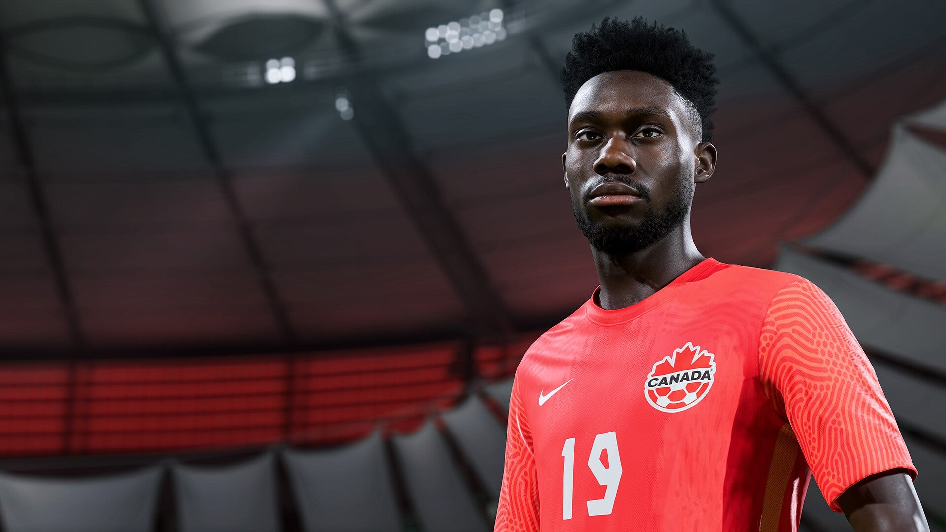 FIFA 23 image showing a player in their Canadian kit, with the blurred lights on the side of the stadium in the background.