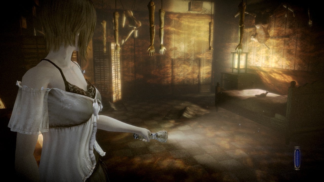 A young woman walks through a dark, empty house in Fatal Frame: Mask of the Lunar Eclipse
