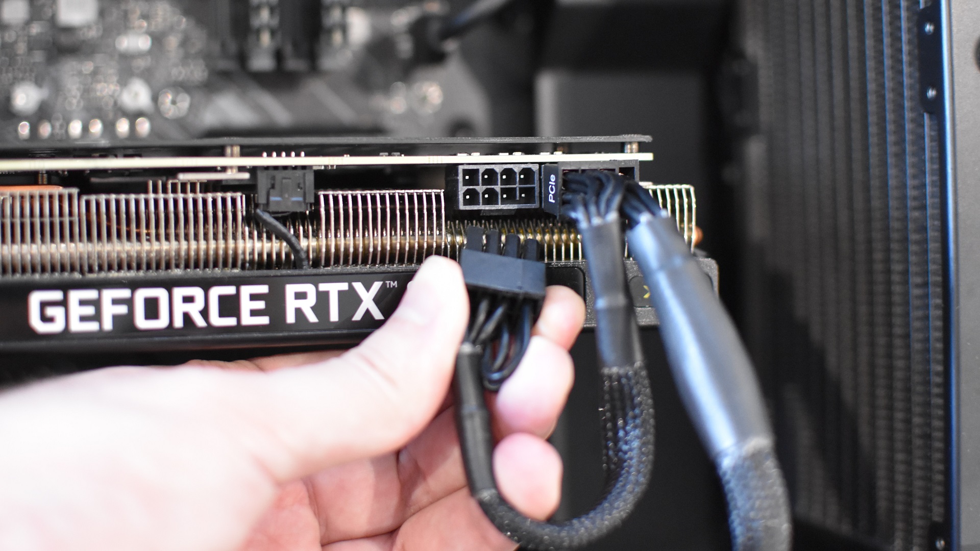Step 5 of how to install a graphics card (GPU): Connect any PSU power cables (labelled 'PCIe) that the graphics card needs.