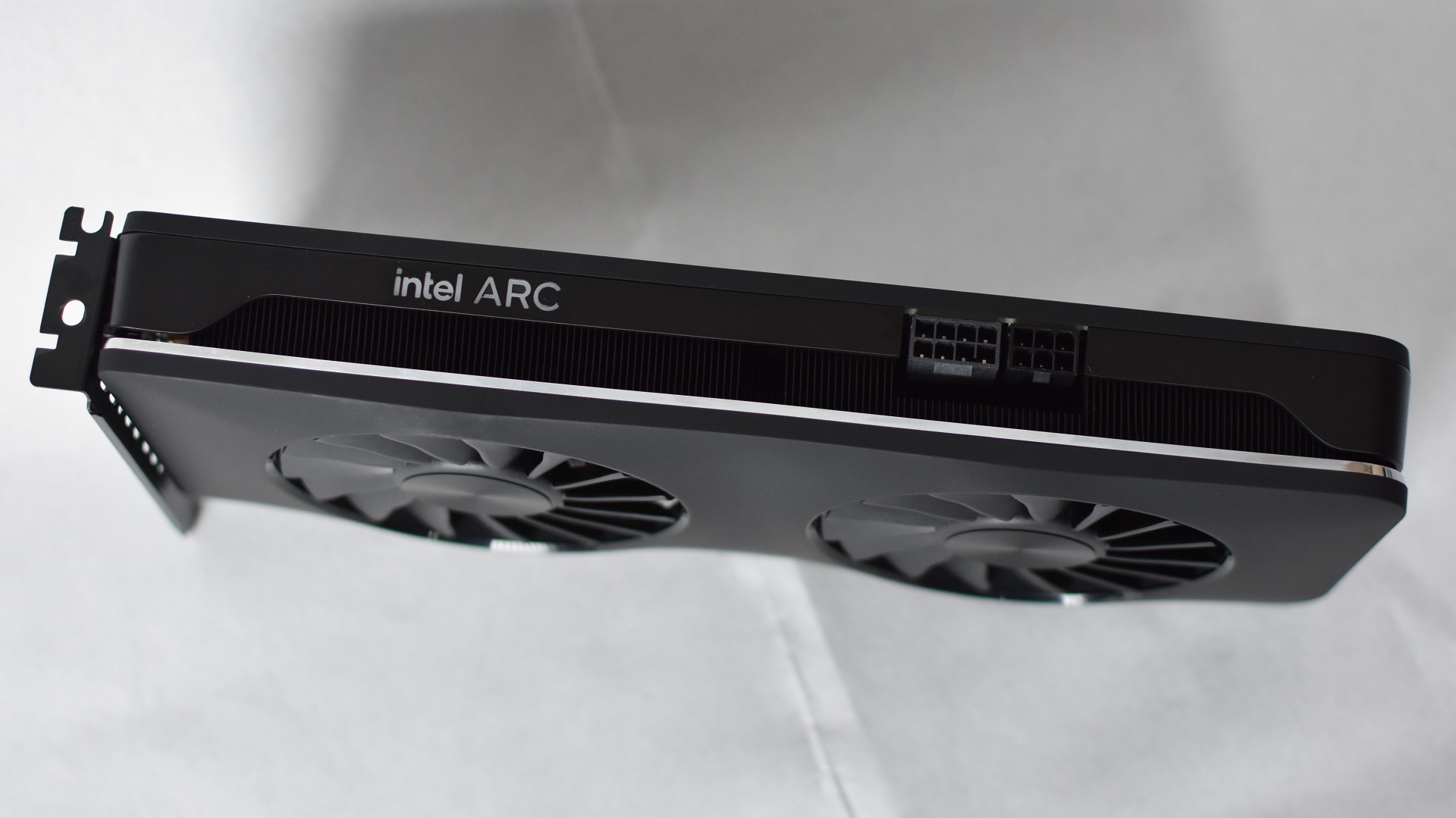 A side view of the Intel Arc A750 Limited Edition graphics card, showing its power connectors.