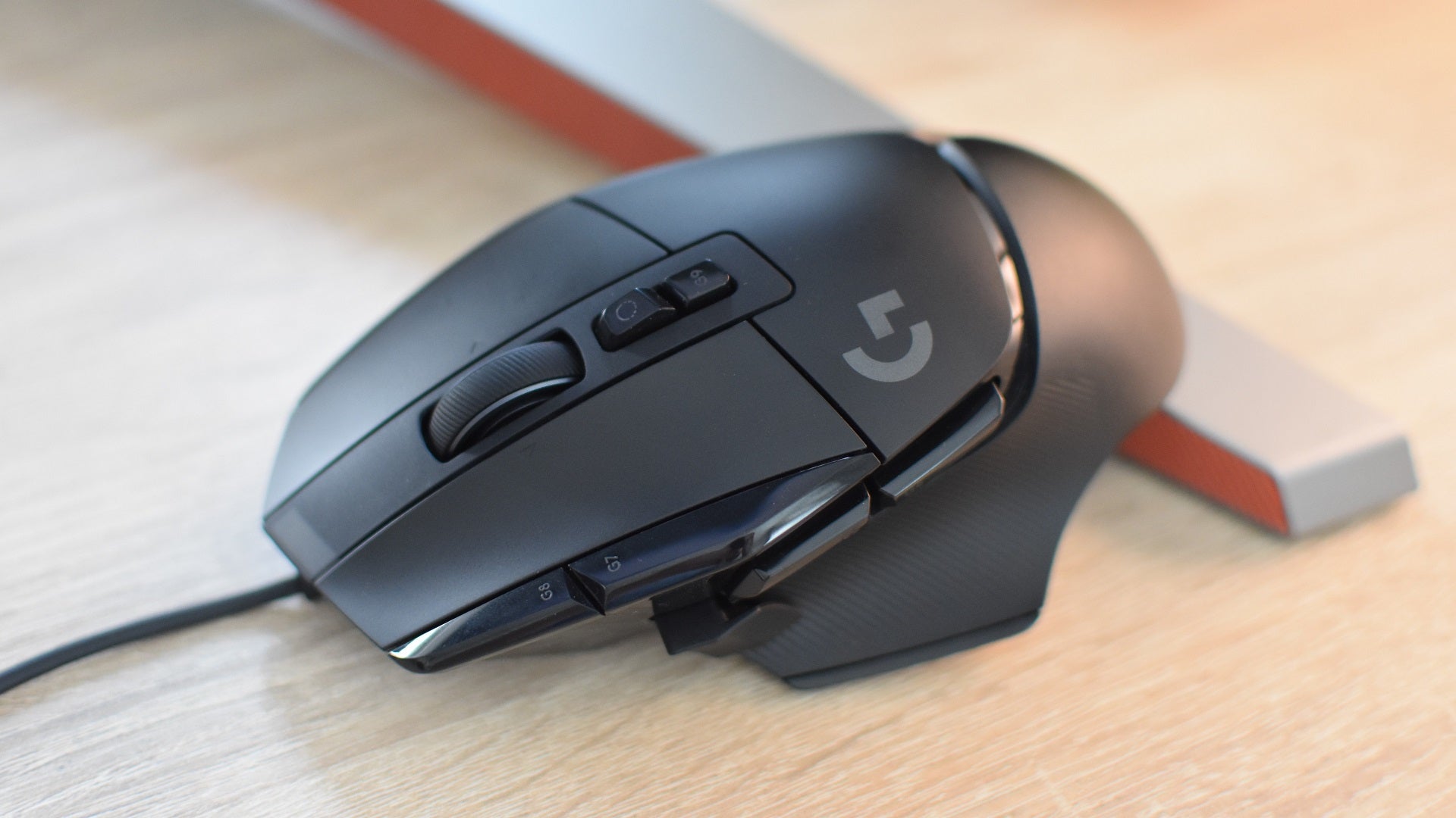 The Logitech G502 X gaming mouse on a desk.