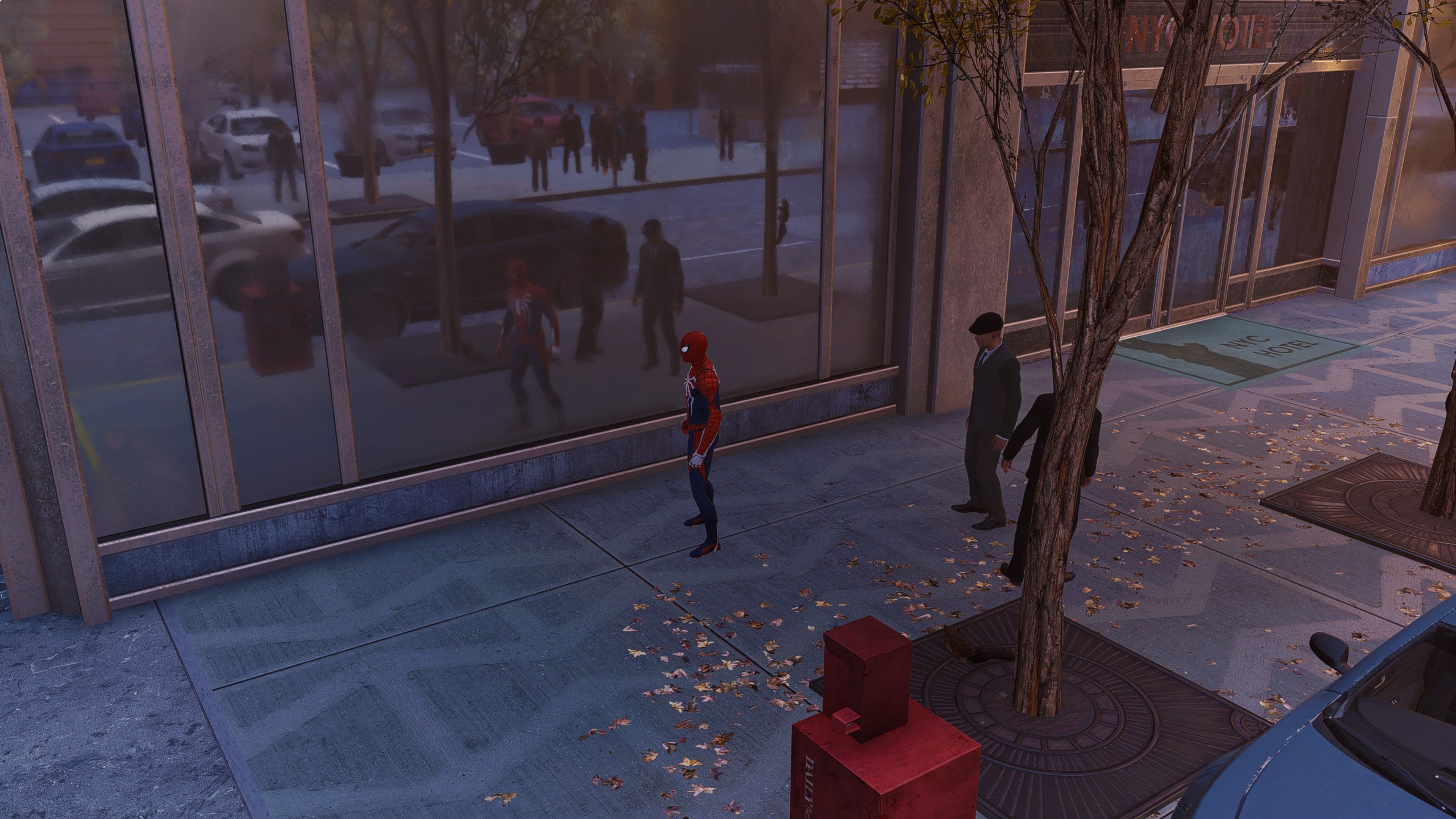 Spider-Man stands in front of a window in Marvel's Spider-Man Remastered, with ray tracing enabled.