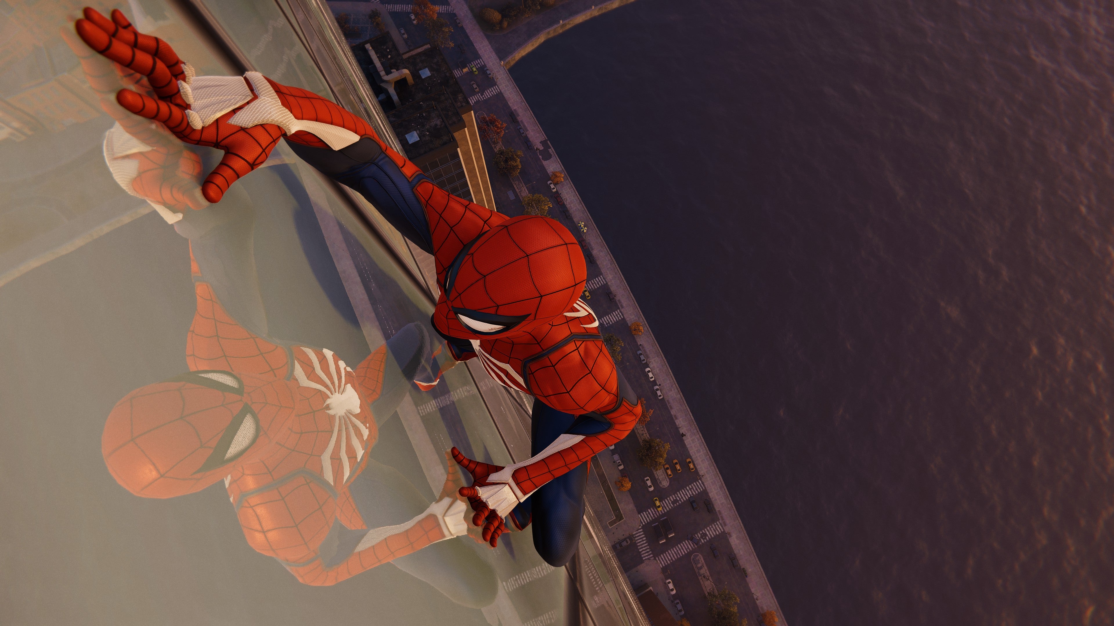 Spider-Man crawls up a skyscraper in Marvel's Spider-Man Remastered.