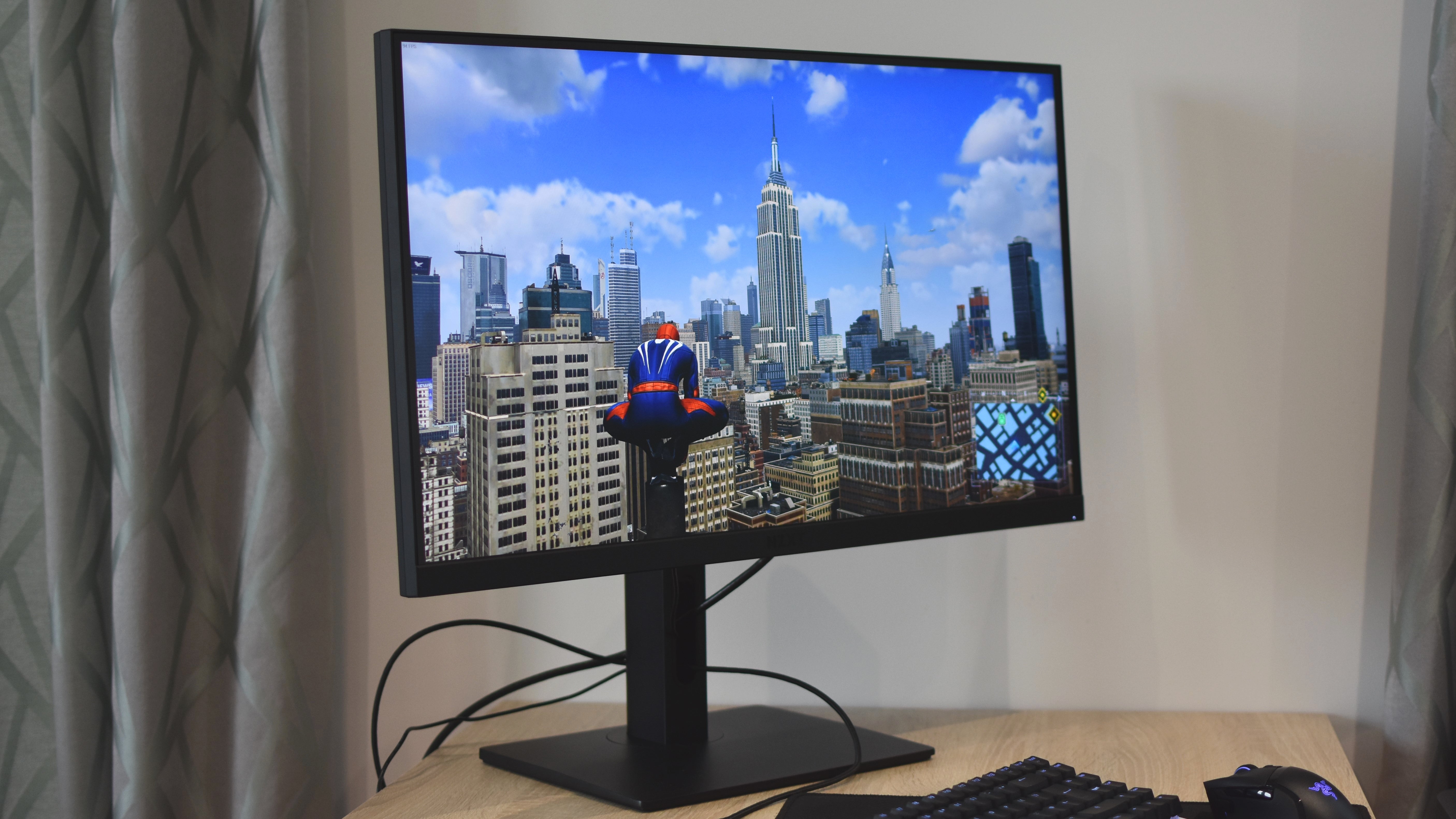 The NZXT Canvas 27Q gaming monitor, showing Marvel's Spider-Man Remastered.