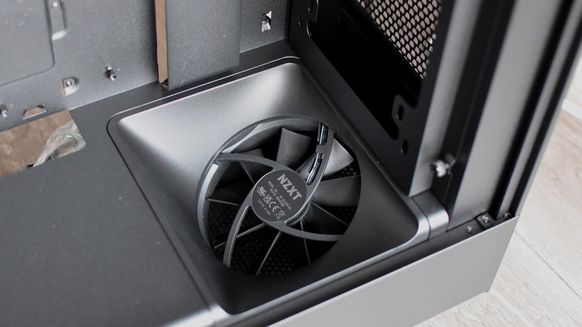 The angled intake fan inside the NZXT H5 Flow chassis.