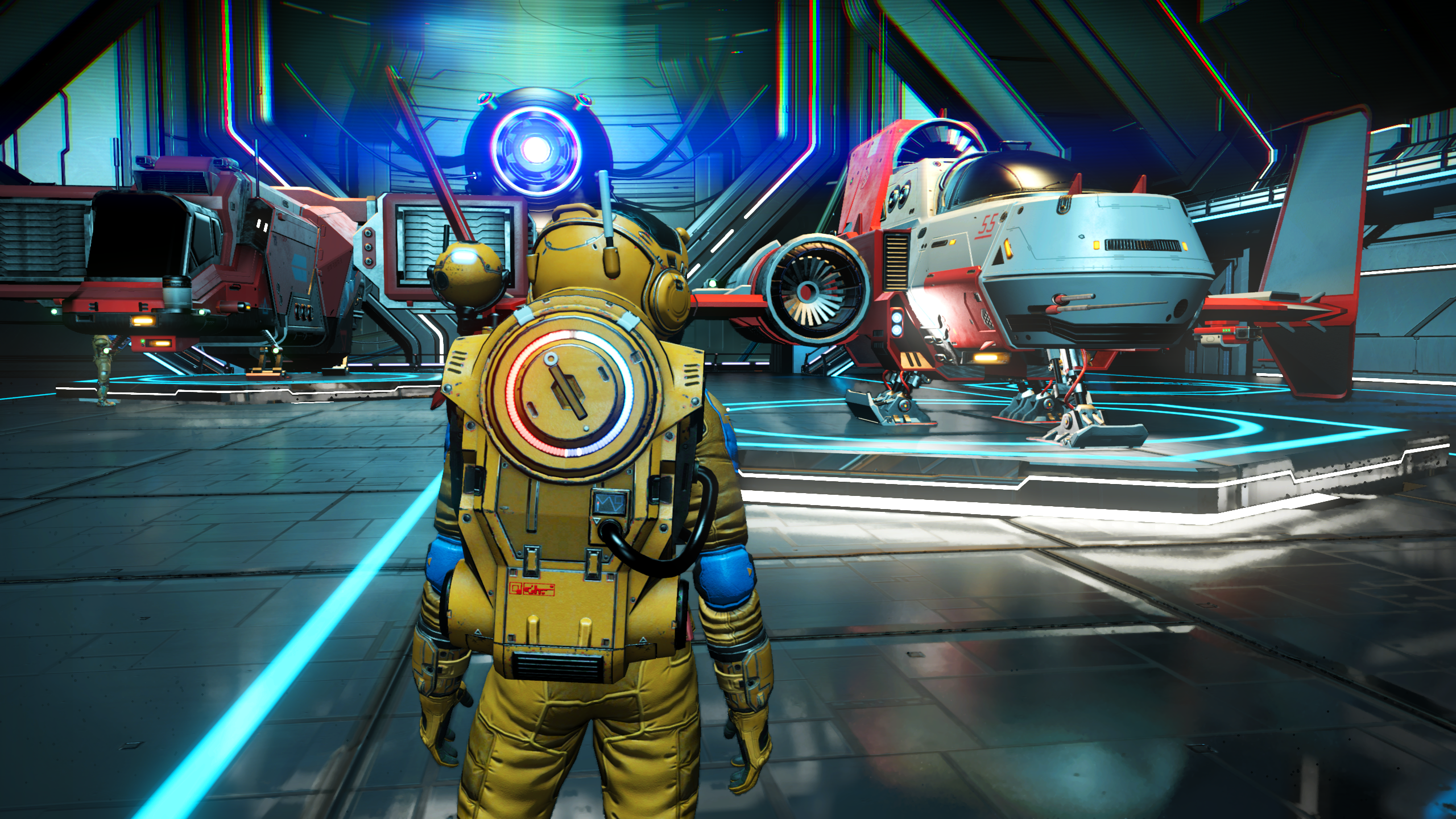 TAA used in No Man's Sky. A spaceman stands in front of some spaceships within a hangar.