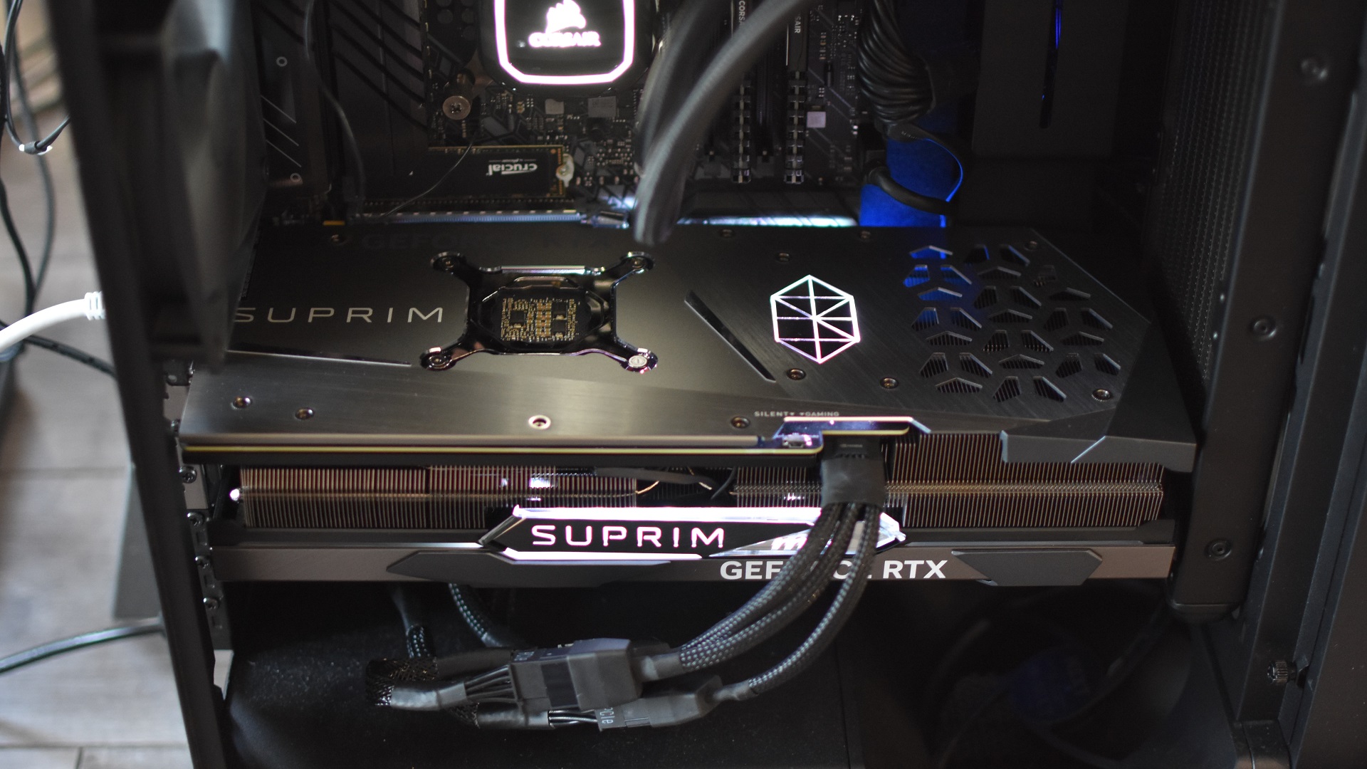 The MSI GeForce RTX 4070 Ti Suprim X 12G graphics card installed and running inside a PC.