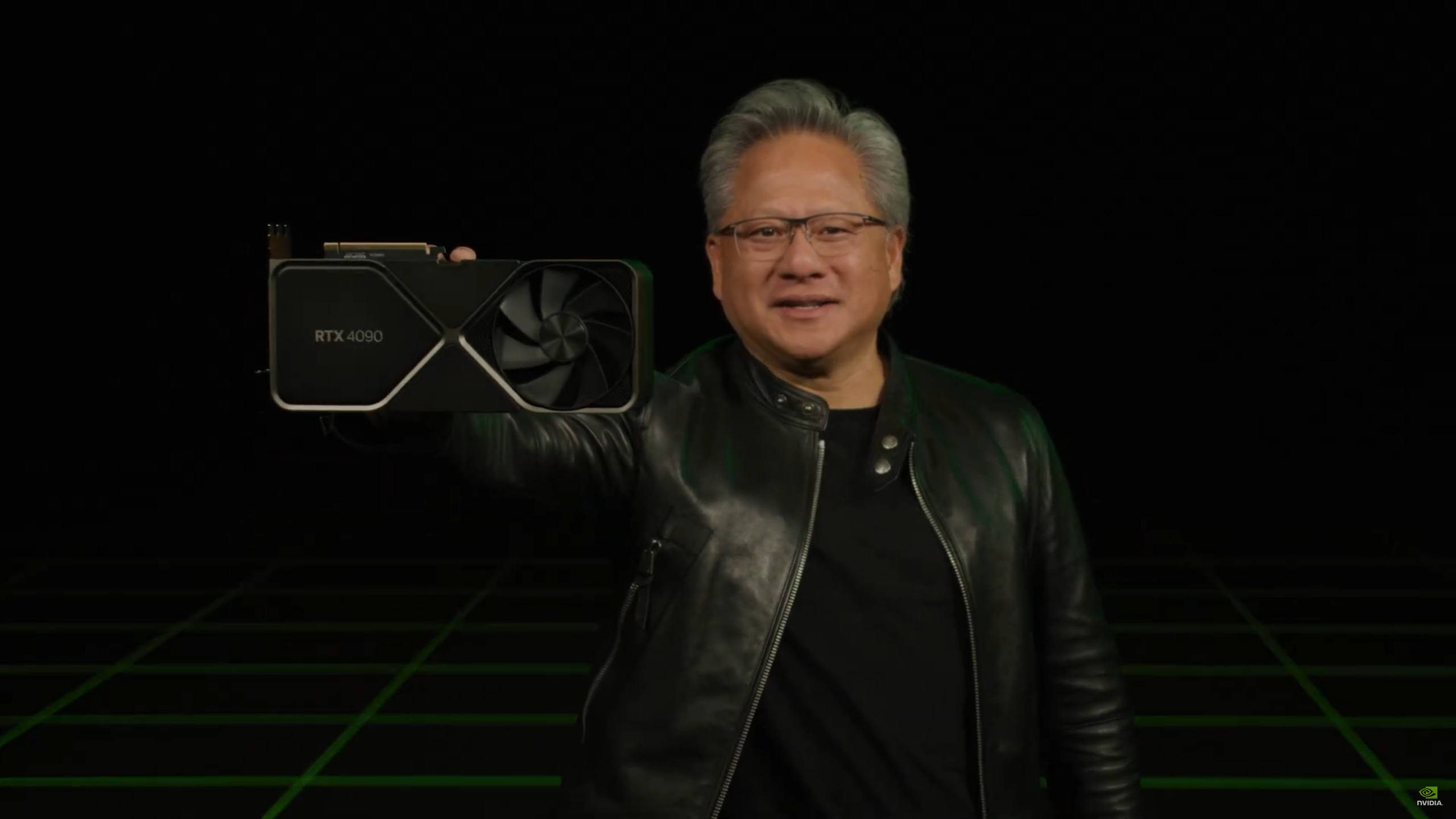Nvidia CEO Jensen Huang holding up a GeForce RTX 4090 Founders Edition.
