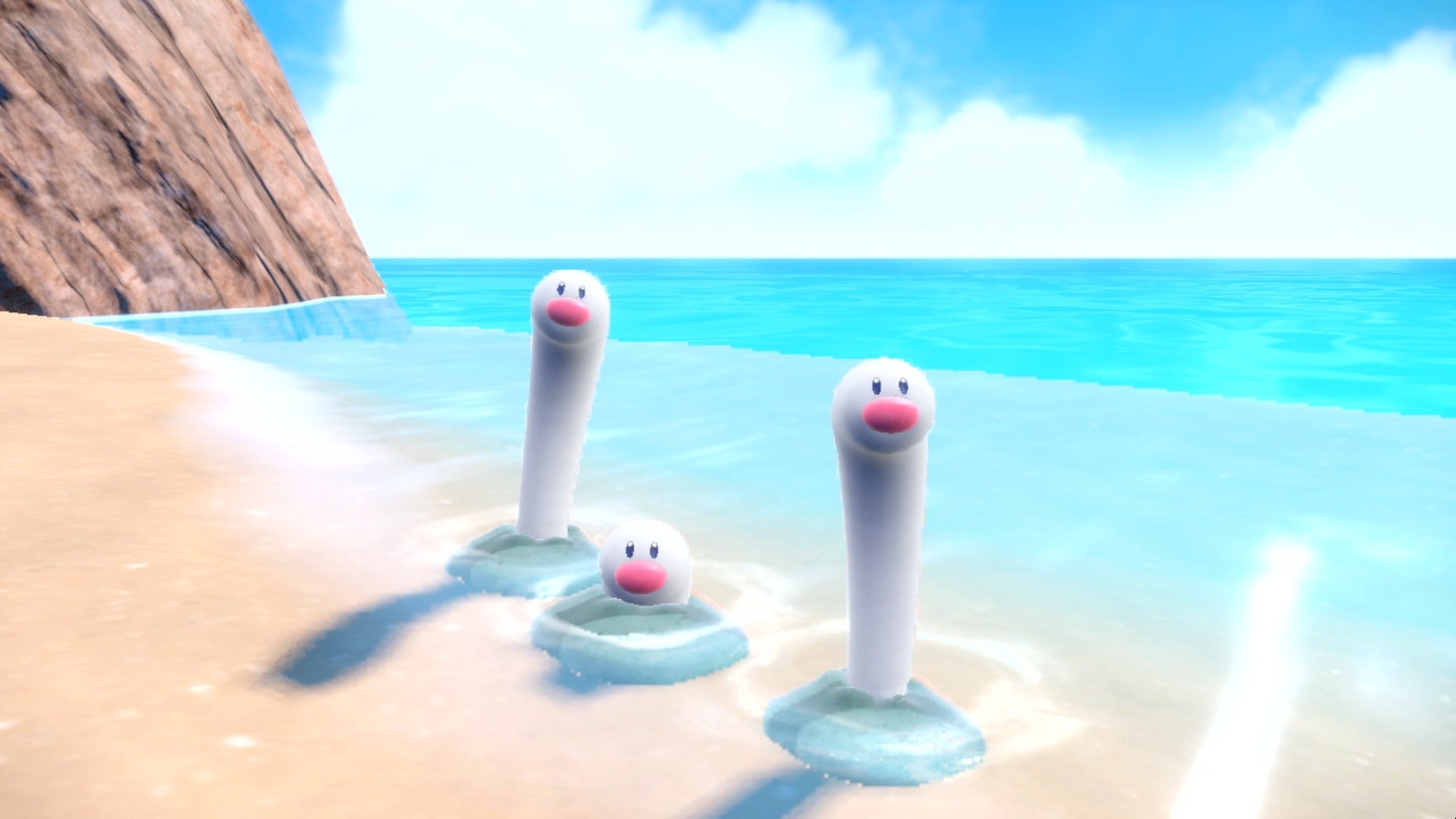 Pokemon Scarlet and Violet image showing three Wiglett along the coast of a sunny beach.