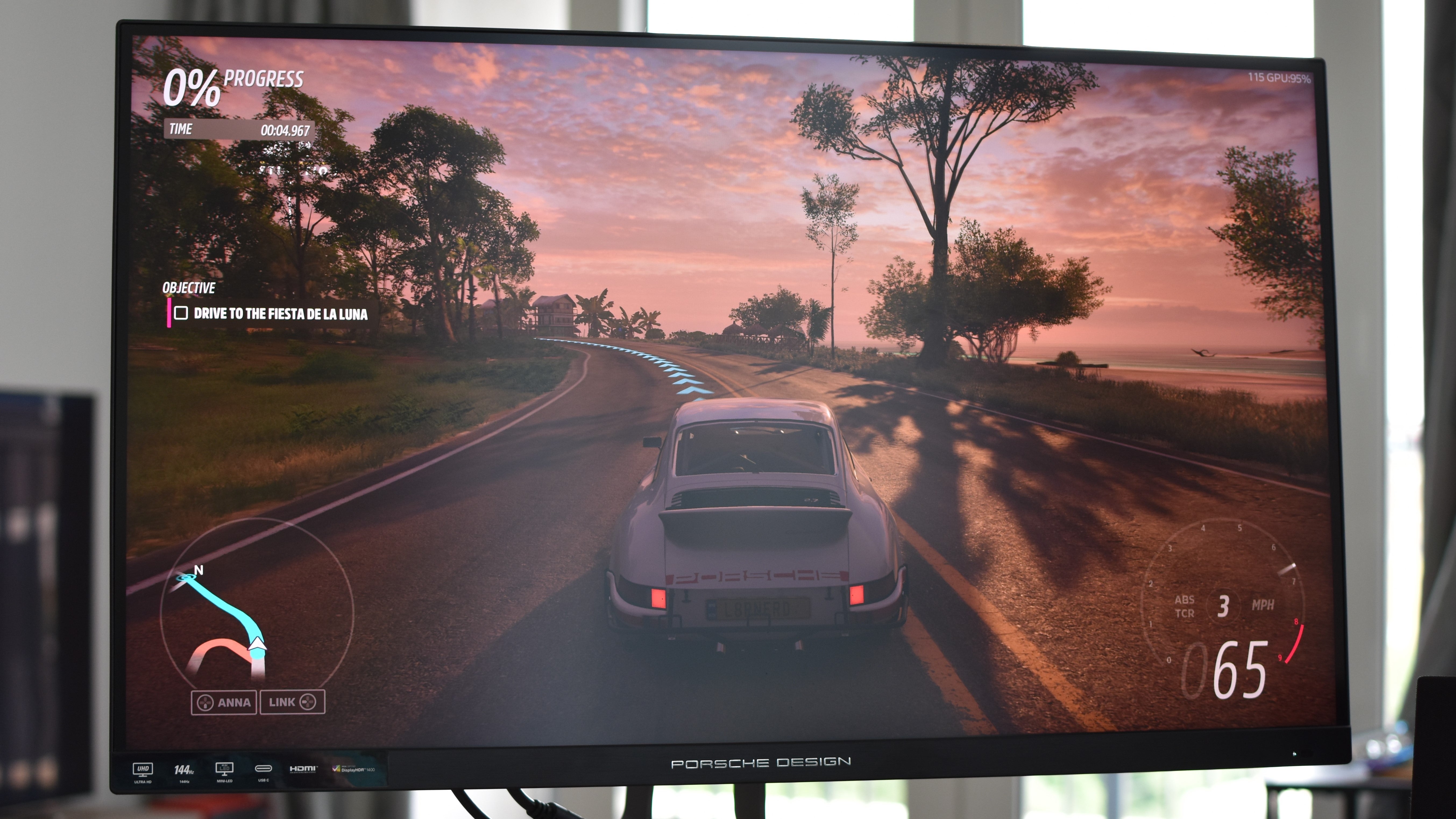 The Porsche Design AOC Agon Pro PD32M gaming monitor showing Forza Horizon 5 in action.