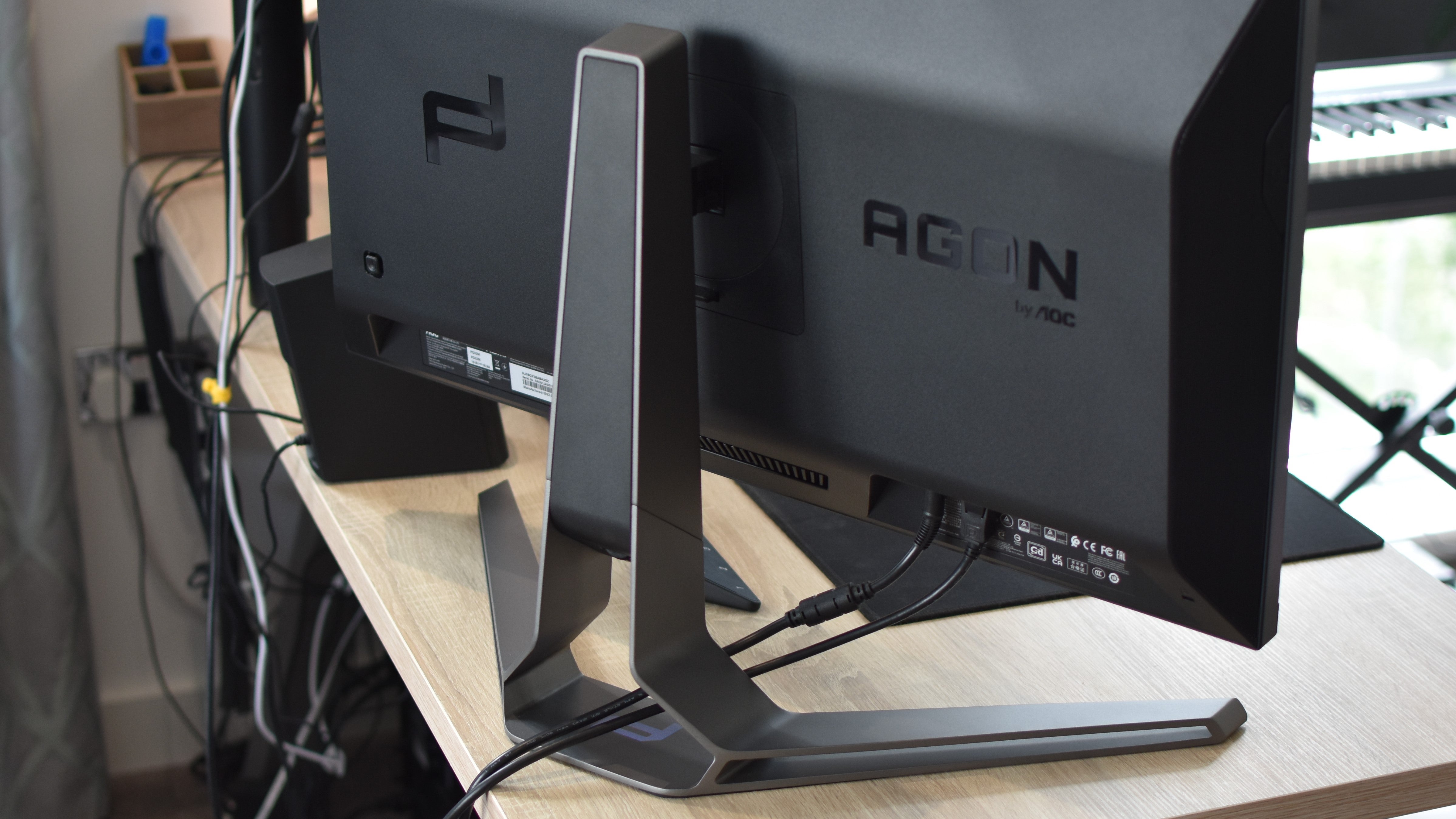 A rear view of the metal stand on the Porsche Design AOC Agon Pro PD32M gaming monitor.