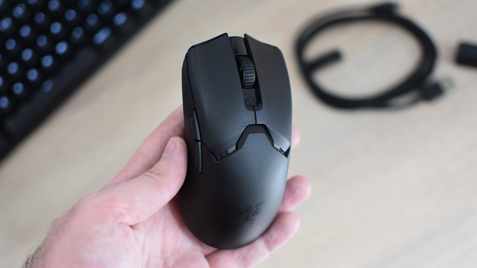 The Razer Viper V2 Pro gaming mouse being held in a hand.