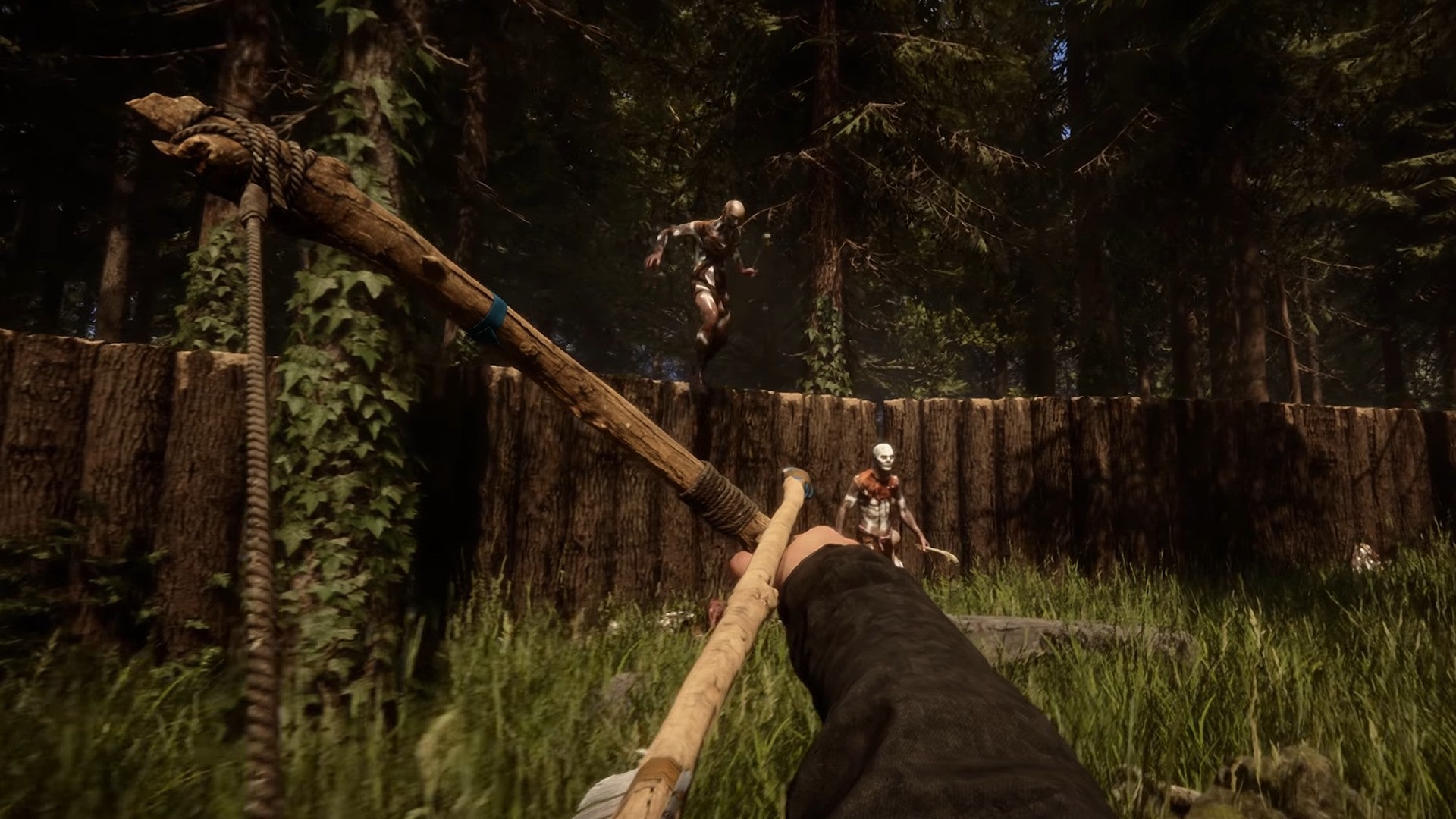 A player aiming a bow at two mutants as they vault a wooden wall in Sons of the Forest.
