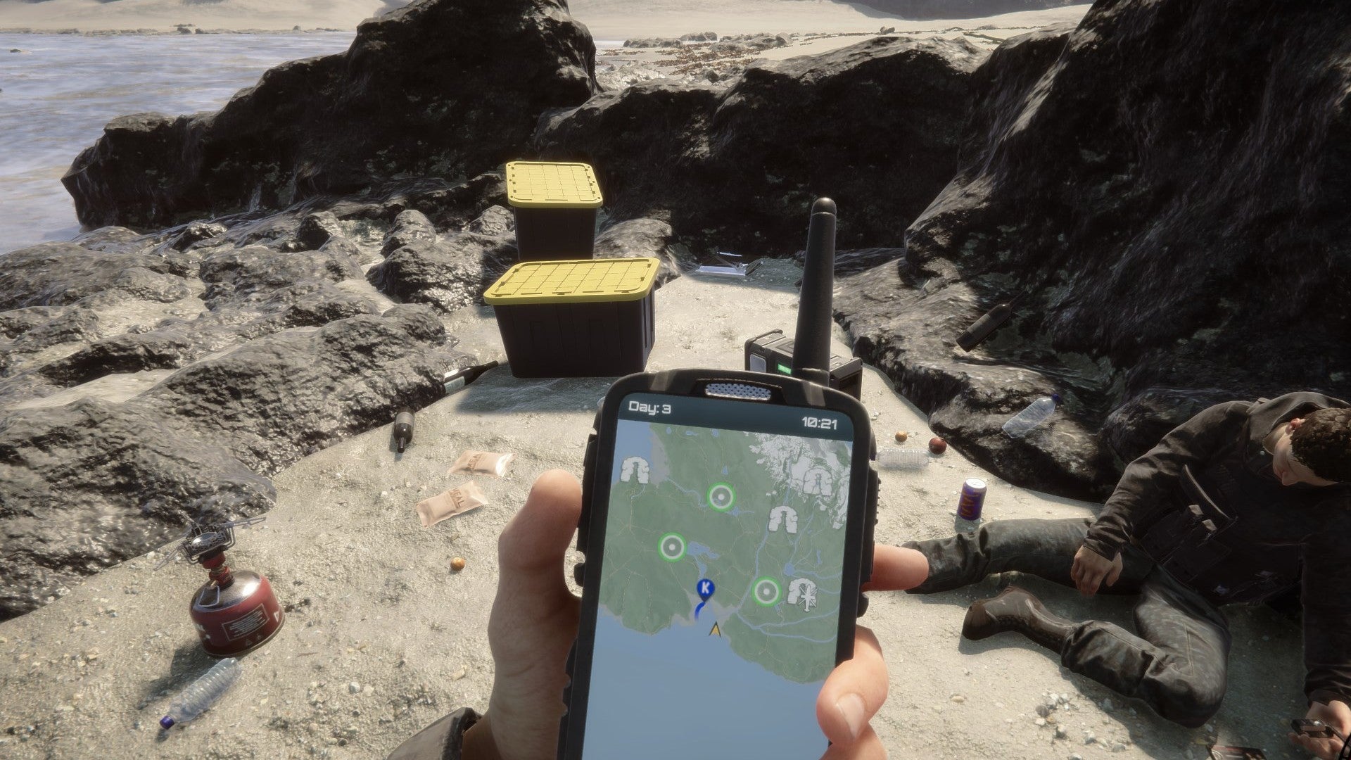 A player stares at their GPS on the beach in Sons of the Forest.