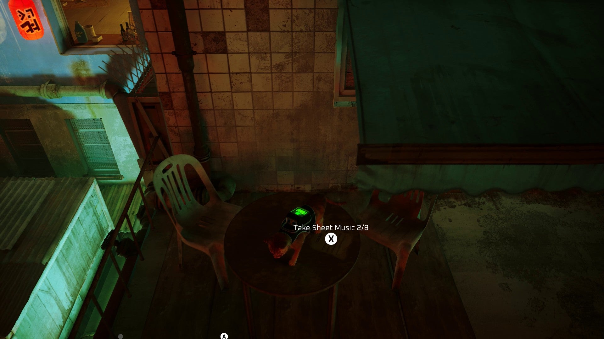 Stray screenshot showing a cat stood on a garden table on a balcony. The cat is staring at a piece of sheet music. On the left, the street below is lit with neon signs.