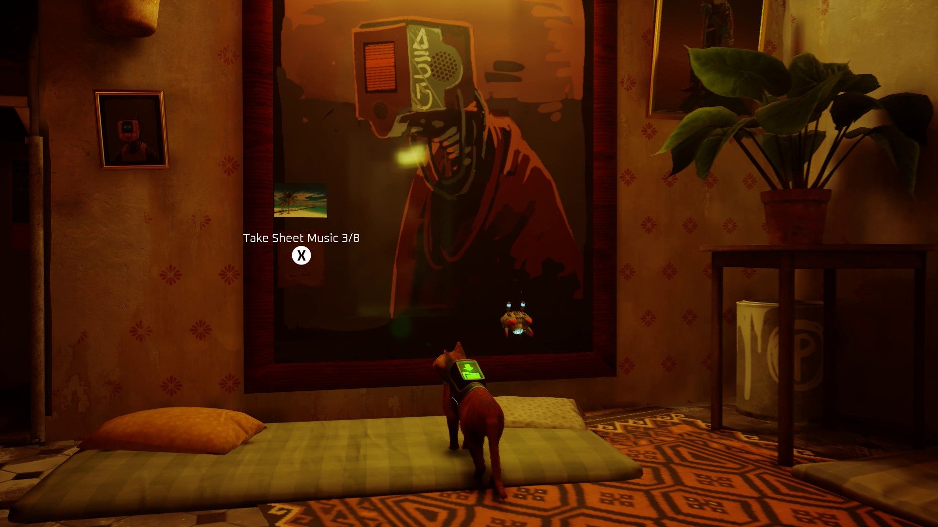 Stray screenshot showing a cat staring at a large painting on a wall. The room has a mattress on the floor, and there is a piece of sheet music attached to the painting.