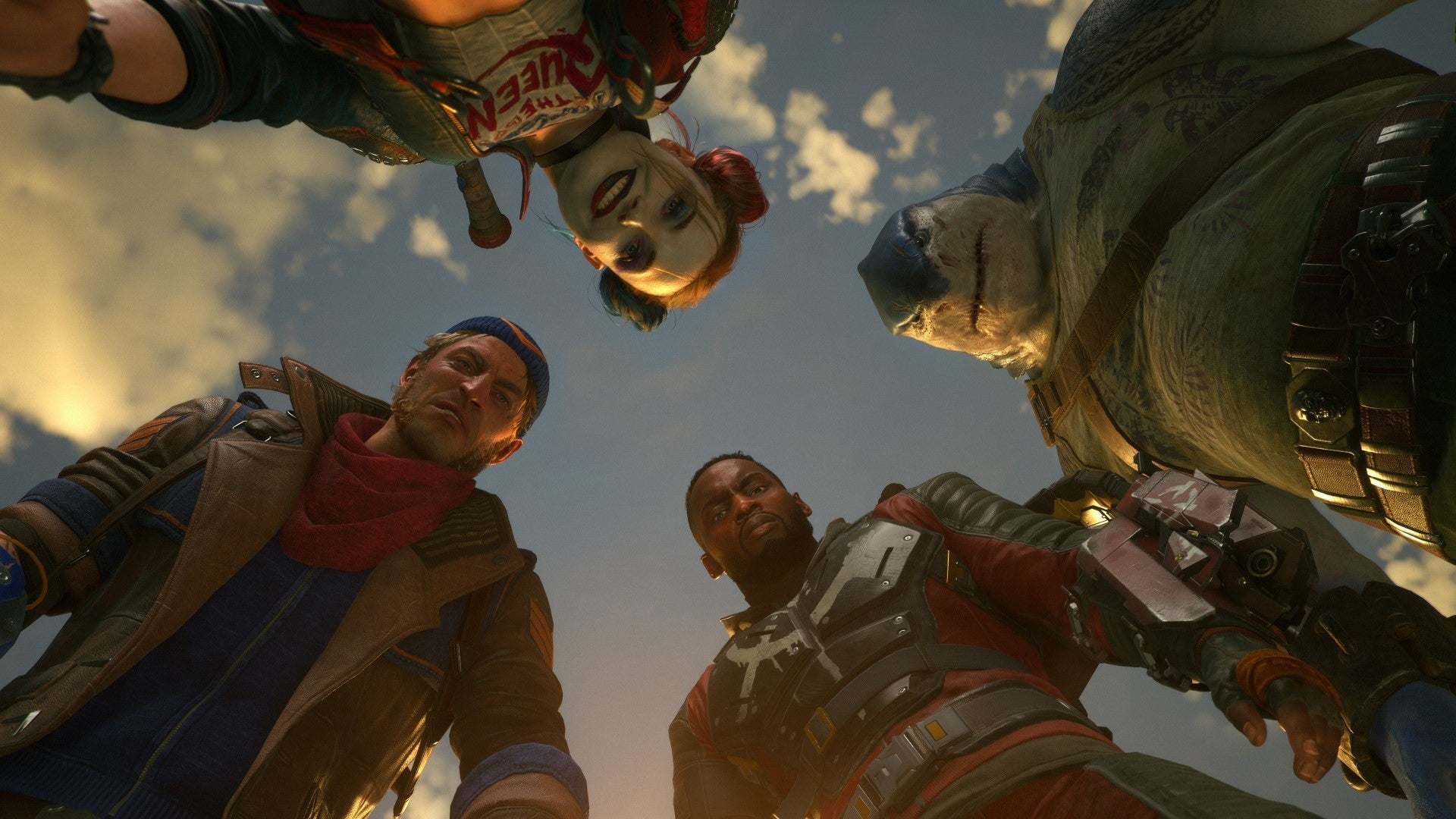 A screenshot from Suicide Squad: Kill The Justice League showing Harley Quinn, Captain Boomerang, Deadshot and King Shark looking down