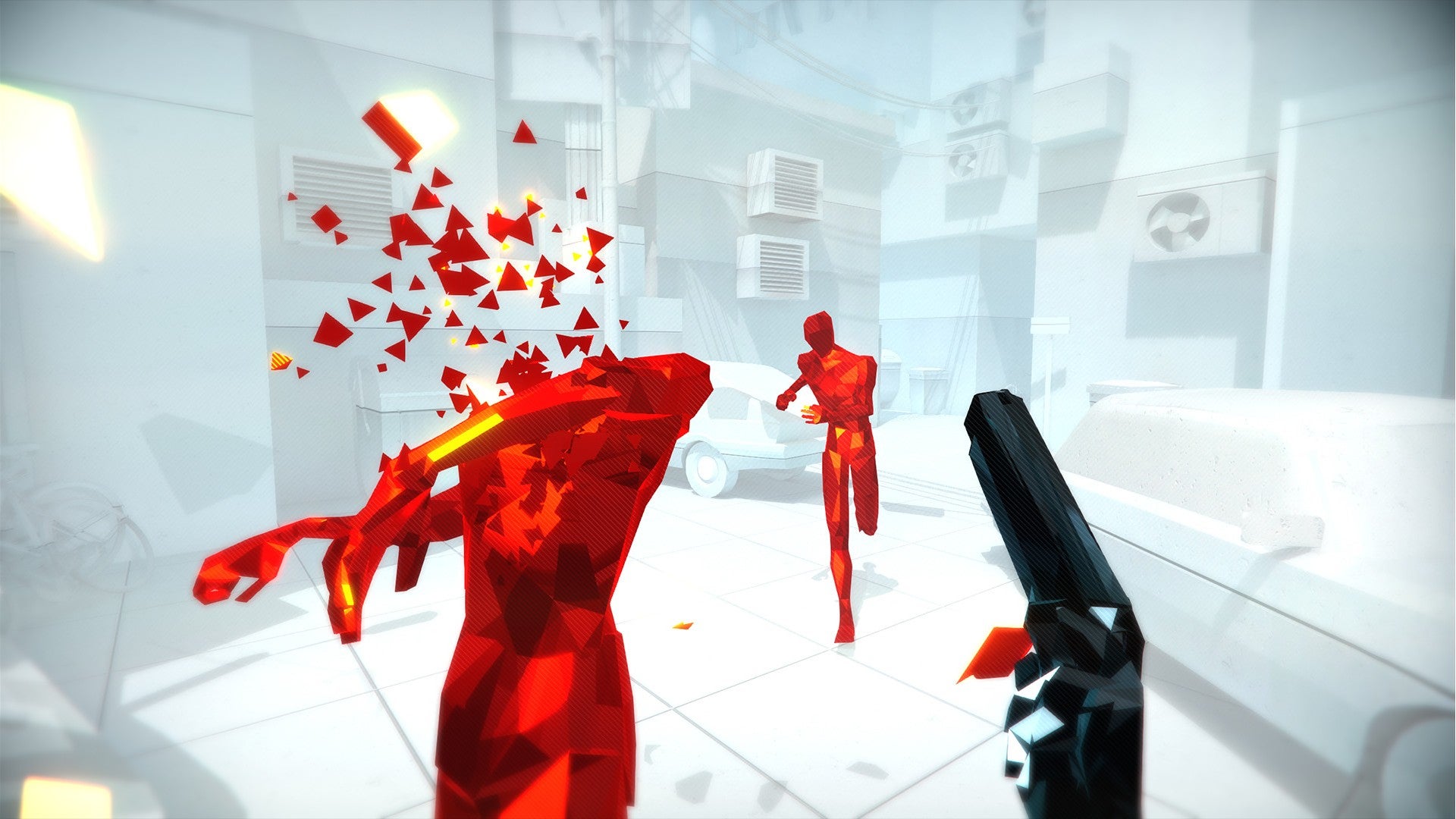 Player headshots an enemy with their pistol as another runs towards them in a white room in Superhot.