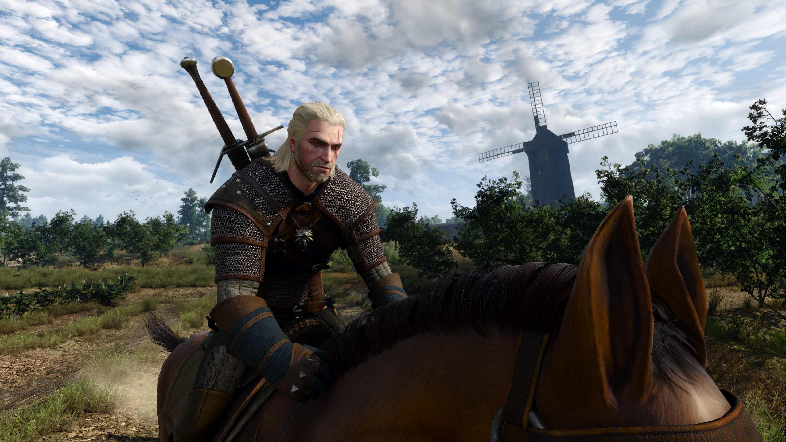 Geralt sits atop his steed Roach in The Witcher 3: Wild Hunt.