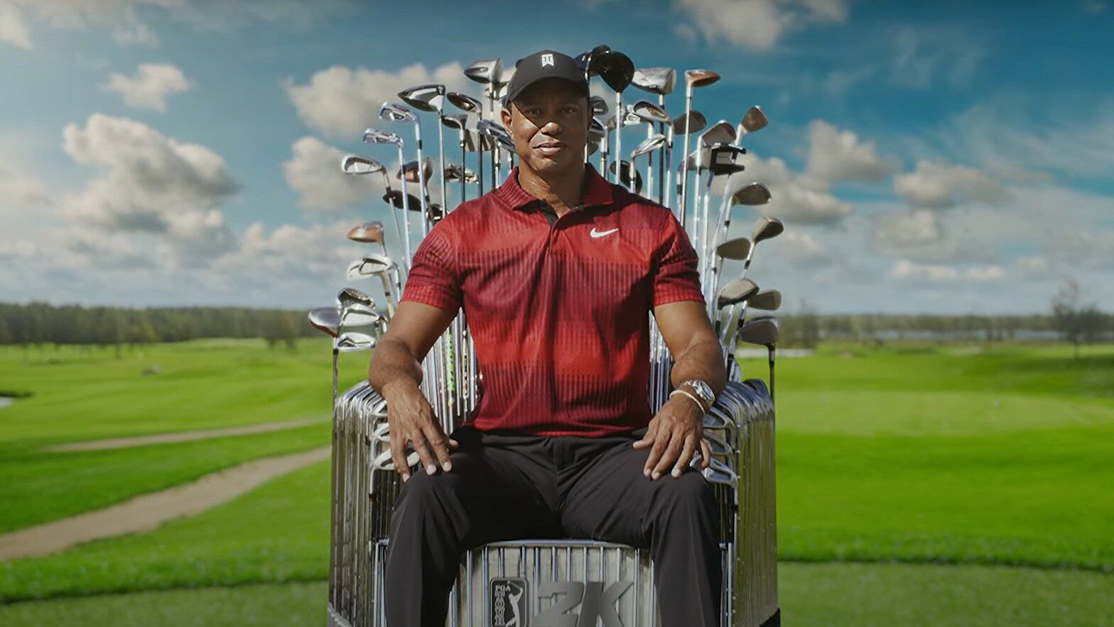Tiger Woods sits in a throne made of golf clubs