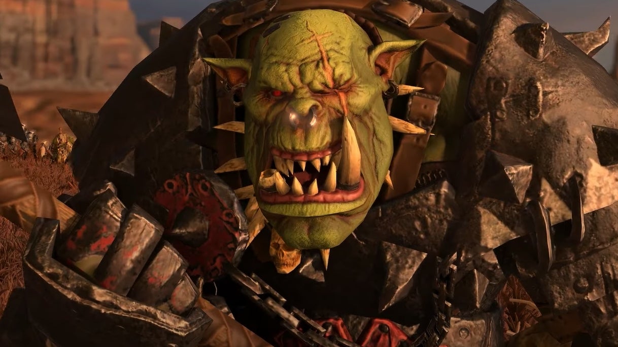 A screenshot from Total War Warhammer 3 showing an ork wielding a weapon