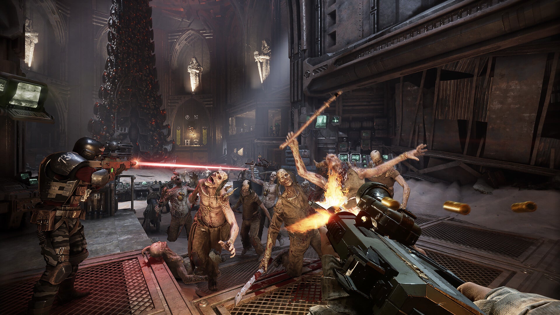 A group of zombies getting pulverised in a gothic cathedral in Warhammer 20k: Darktide