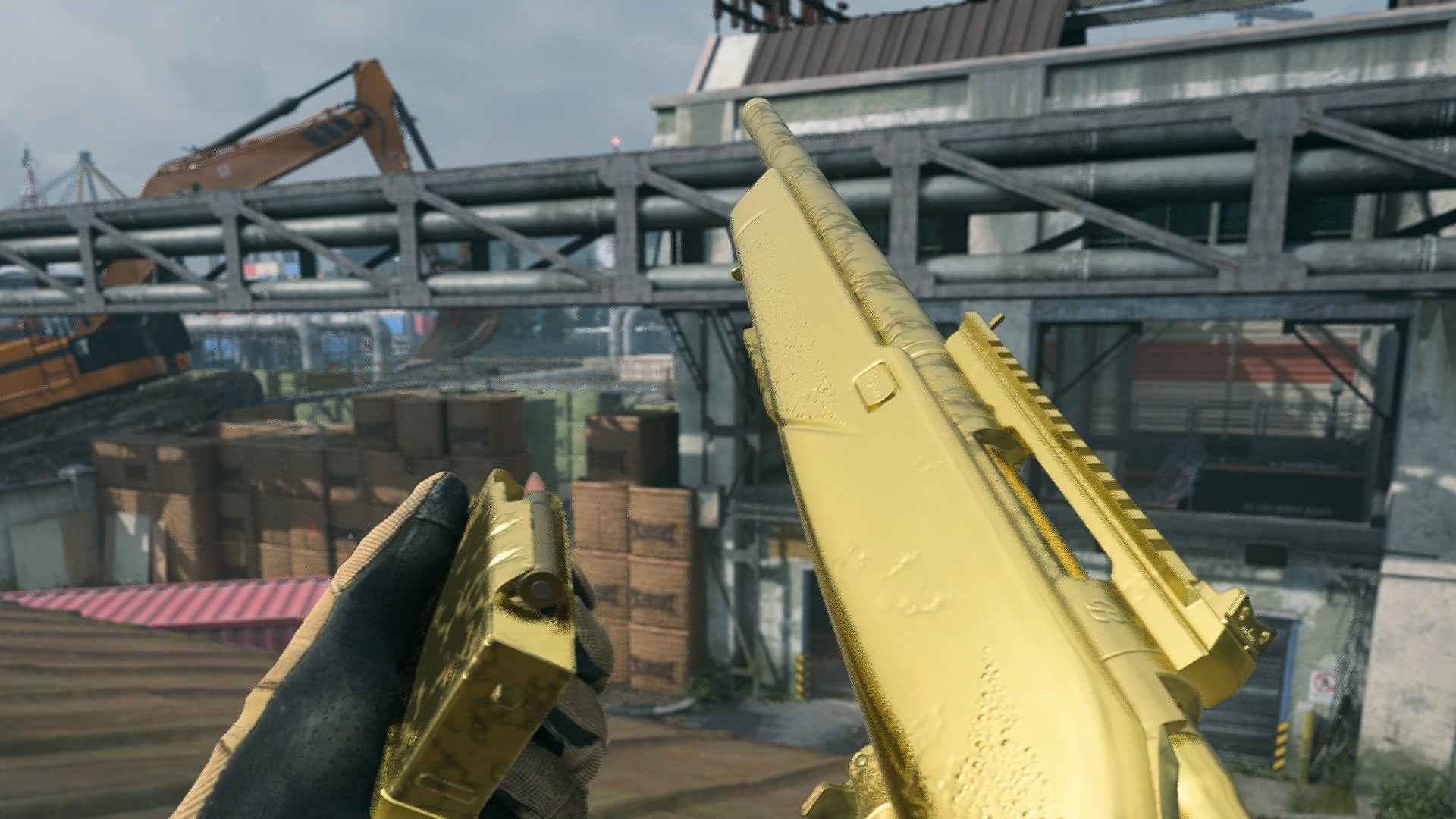 Warzone 2 screenshot showing the SP-R 208 with the gold camo, as a player stands on a rooftop overlooking a factory.