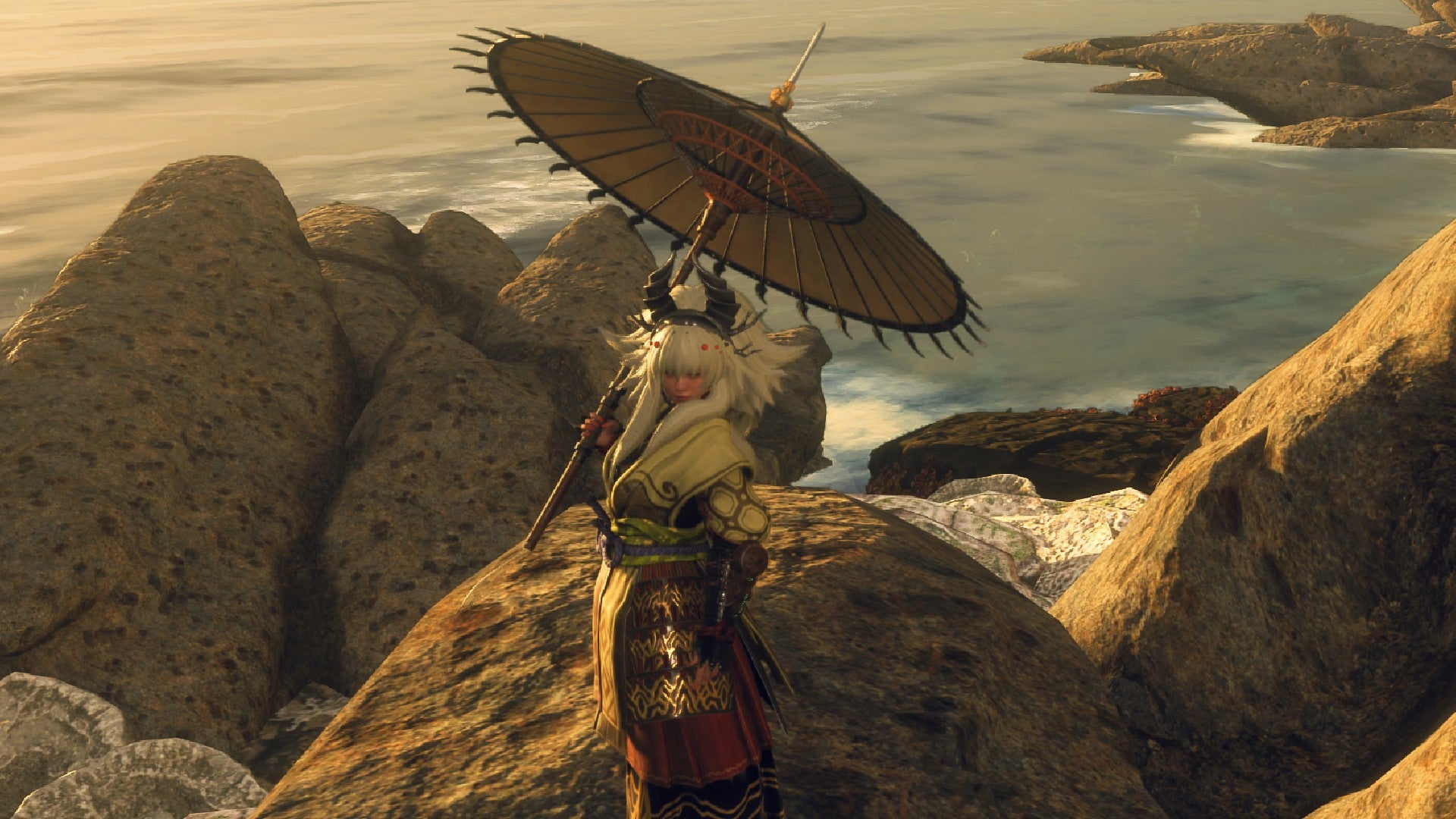 Wild Hearts screenshot showing a player wielding the Bladed Wugasa like an umbrella on some rocks at sunset.