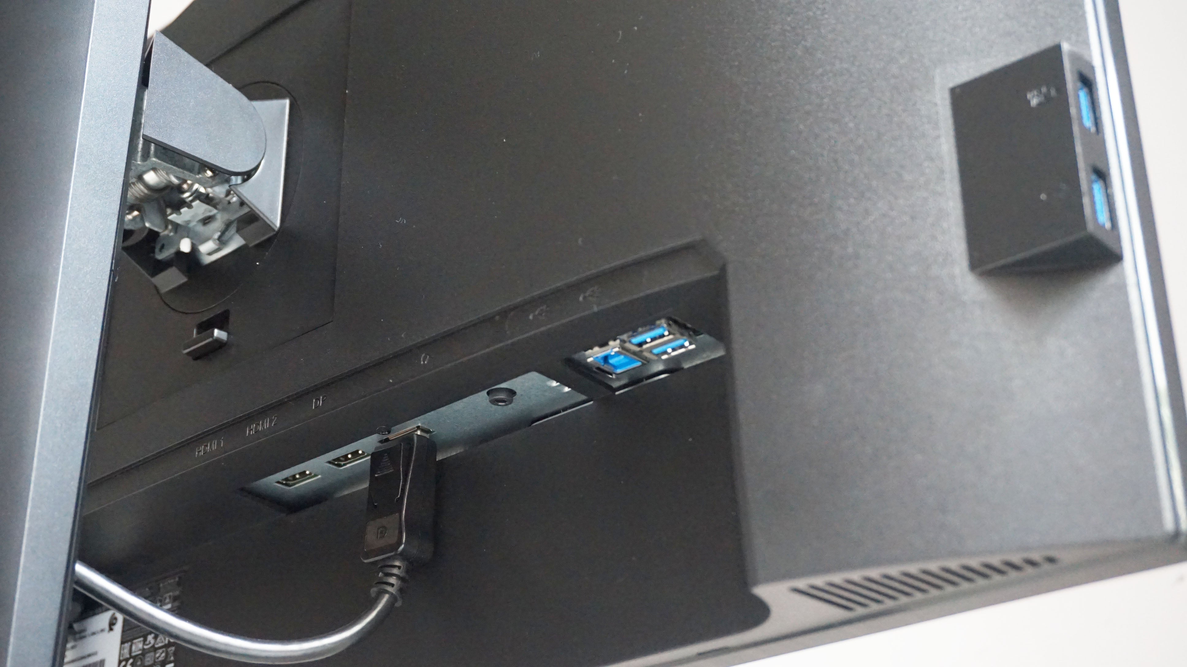 A photo of the Acer Predator XB253Q gaming monitor's display inputs and USB hub