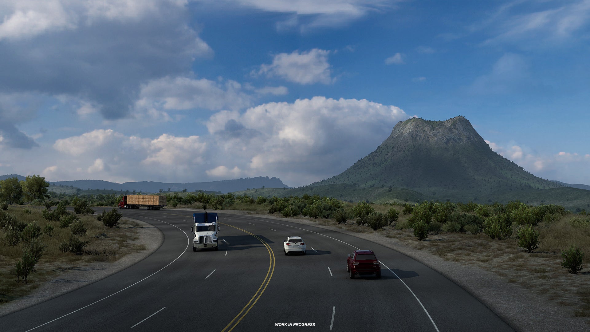 American Truck Simulator Texas - A four lane highway with cars and trucks passes through the plains with a large hill in the background.