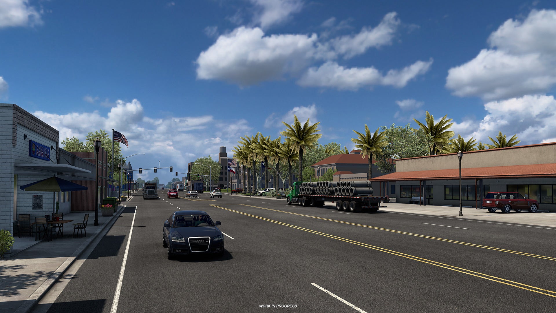 American Truck Simulator Texas - A five lane road with cars and trucks passes through a commercial area with palm trees.