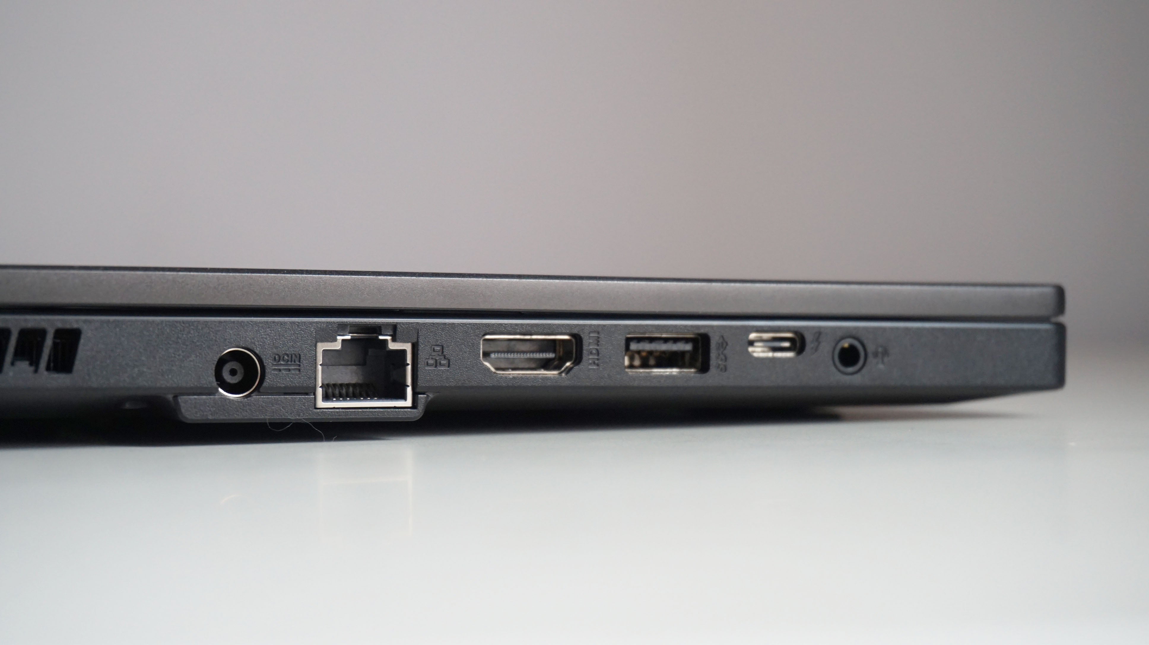 A photo of the Asus TUF Dash 15 gaming laptop's ports on a white desk