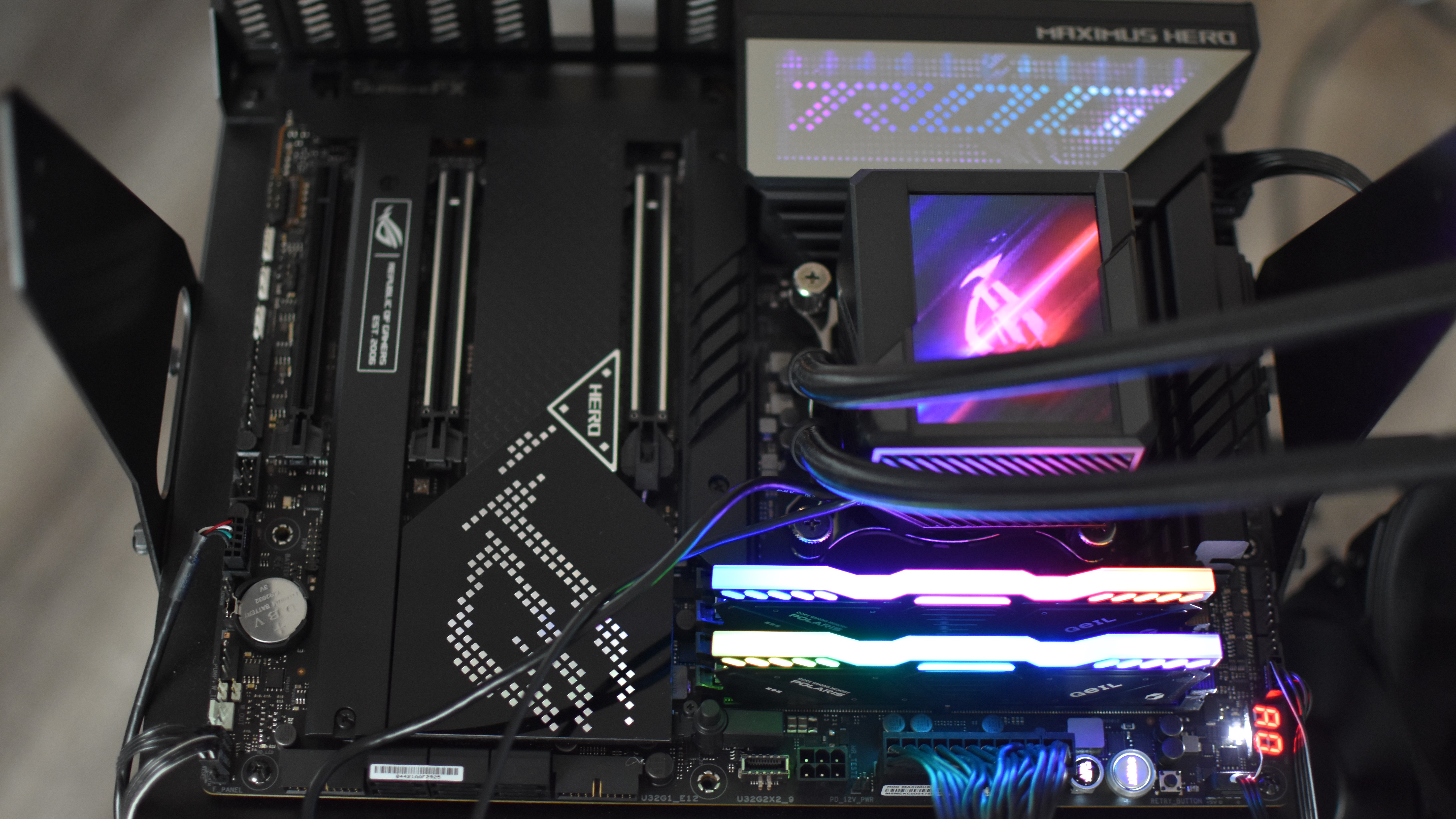 An Asus ROG Maximus Z3690 motherboard with RAM, CPU and cooler installed.