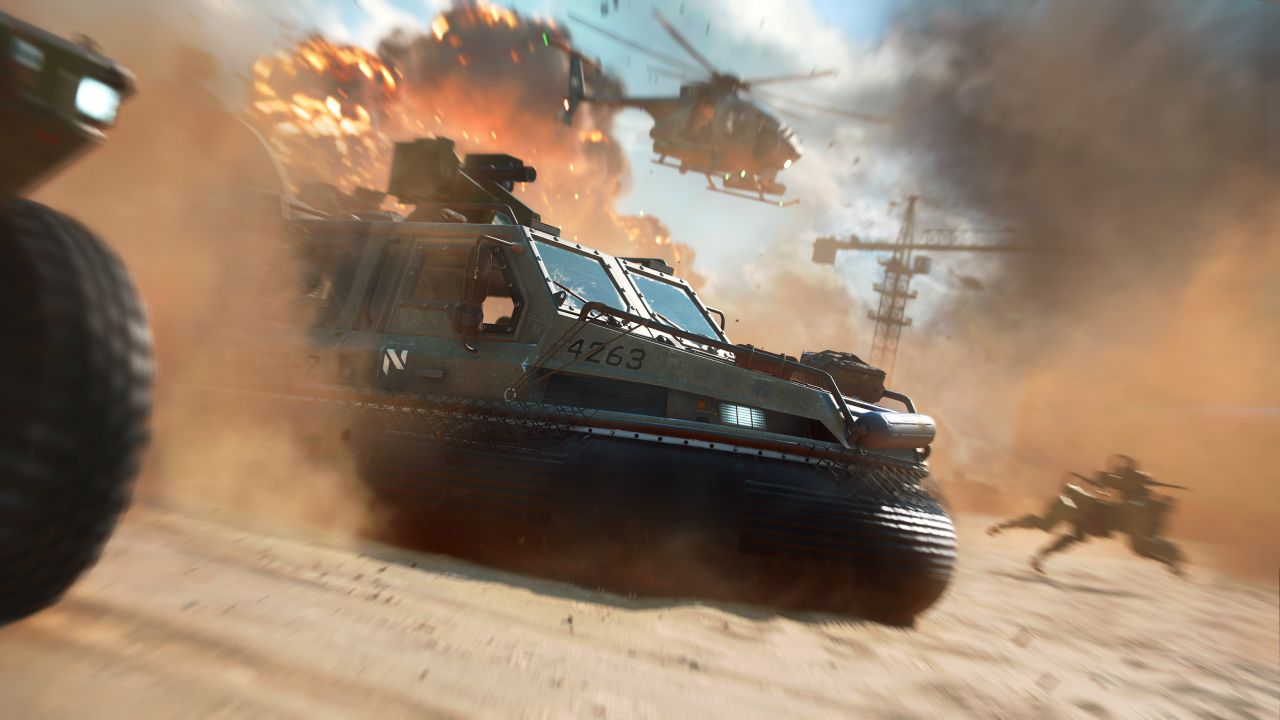 Tanks, a helicopter, and one of those robot war dog things advance through explosions in Battlefield 2042