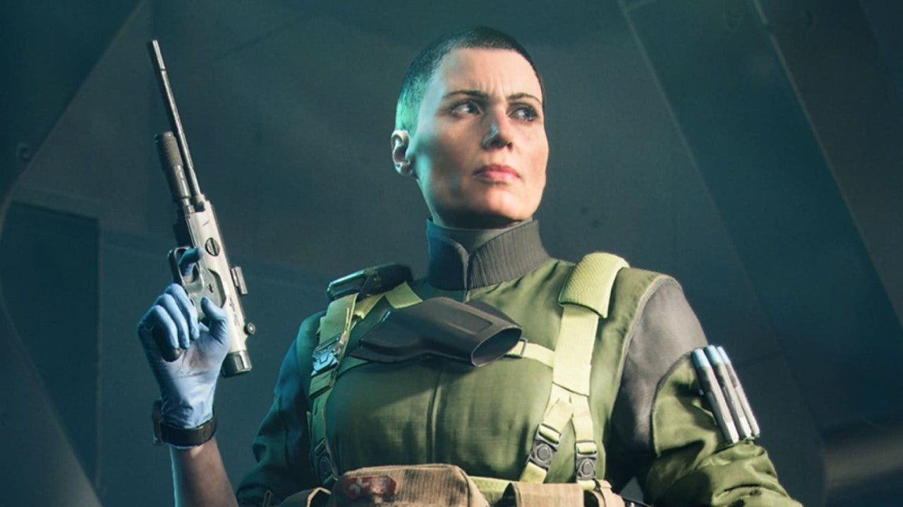 A specialist from Battlefield 2042 holds up a healing pistol.
