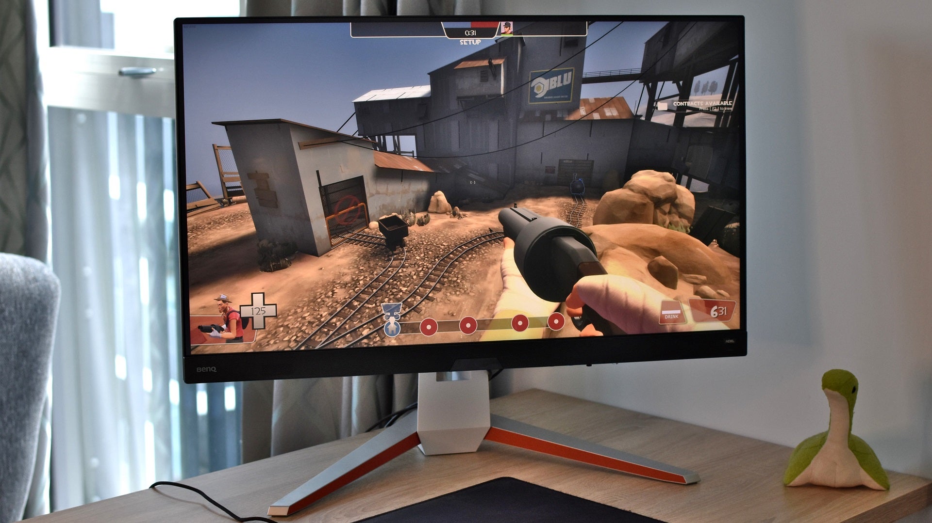 The BenQ Mobiuz EX3210U 4K gaming monitor, showing a scene from Team Fortress 2.