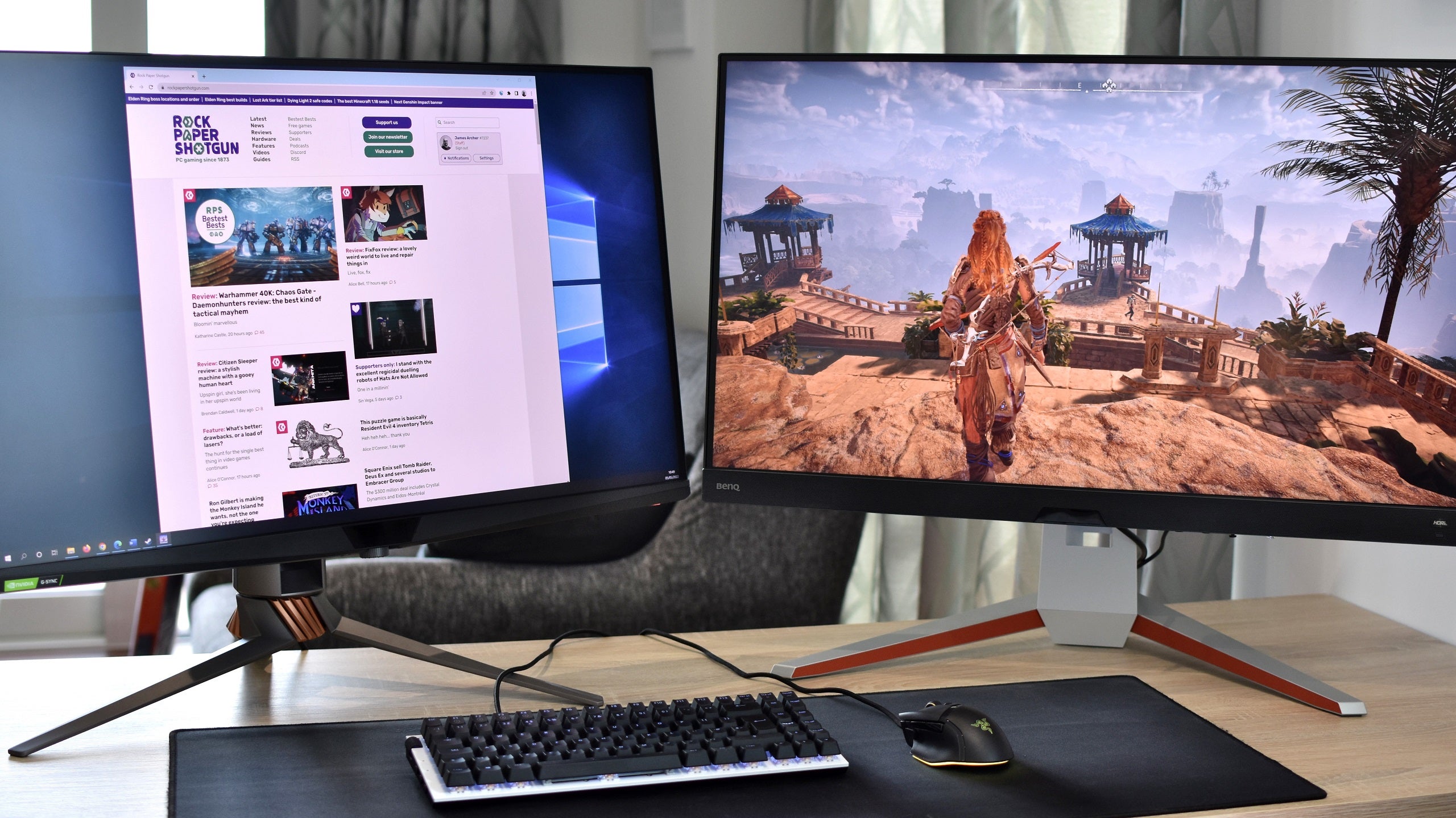 The Asus ROG Swift PG32UQX and BenQ Mobiuz EX3210U, two of the best 4K gaming monitors, on a desk.