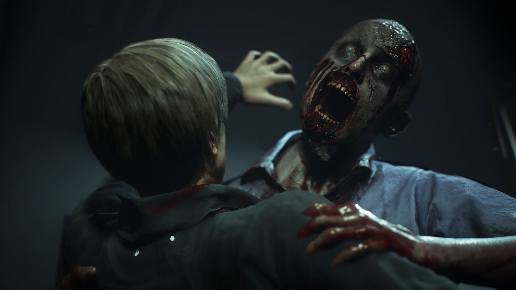 A zombie in Resident Evil 2 the remake, on the attack and about to bite Leon S Kennedy